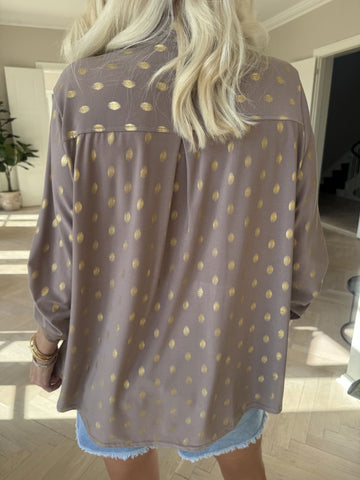 Ebba Gold Shirt - Elastisk blus med guld prickar