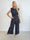 Zina – Elegant set med prickar och veckad design