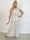 Zina – Elegant set med prickar och veckad design