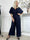 Pams Glitter Jumpsuit - Elastisk jumpsuit med smock och paljetter