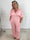 Grace - Stretchig plus size jumpsuit med vita prickar