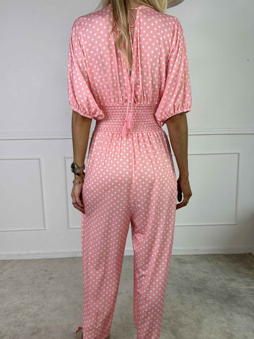 Grace - Stretchig jumpsuit med vita prickar