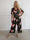 Pams Raise Jumpsuit - Elastisk buksedragt med blomsterr og guldsommerfugle