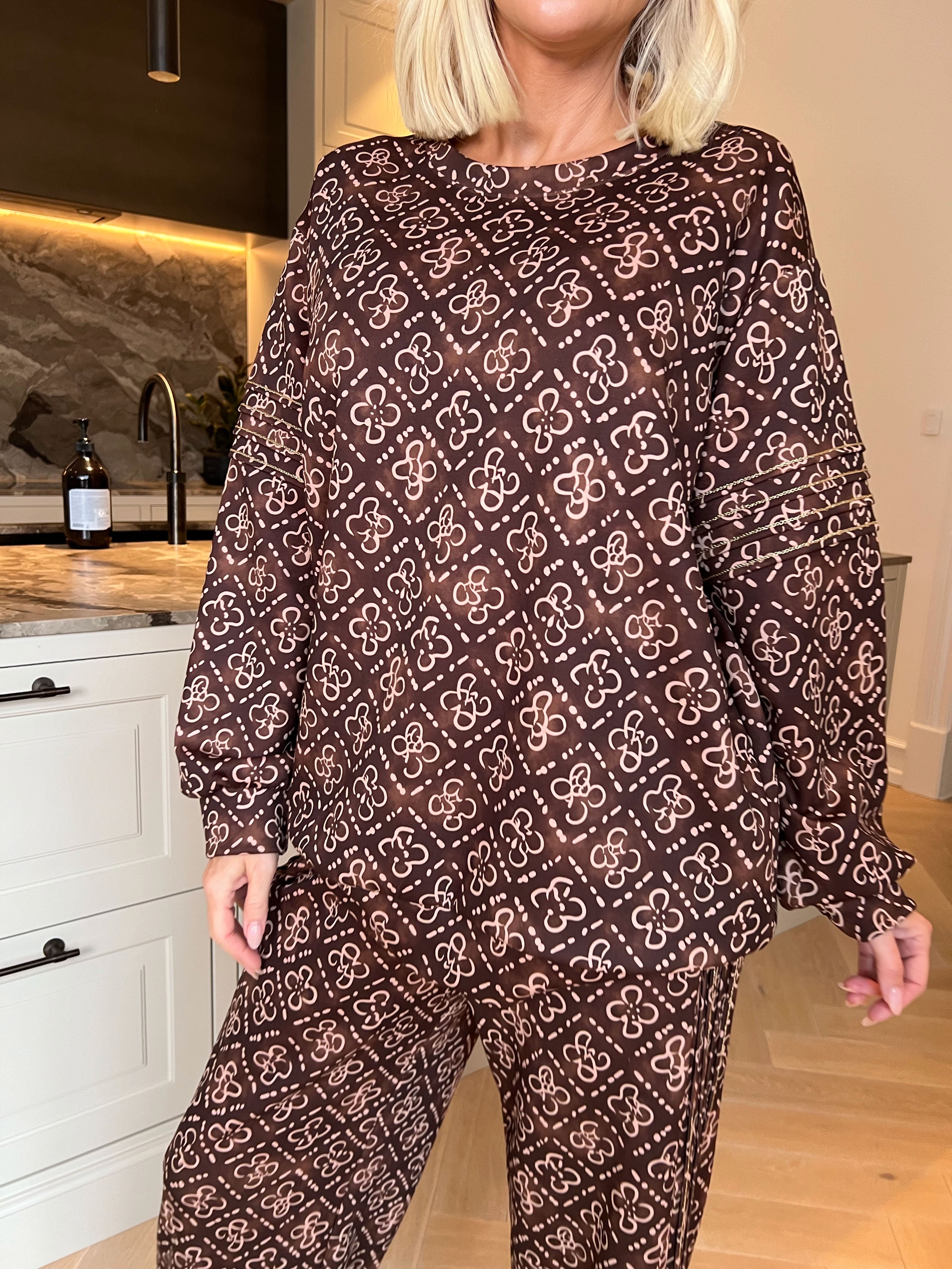 Dream Pattern - Träningsoverall i viskos med trendigt mönster, gulddetaljer och ribbade kanter