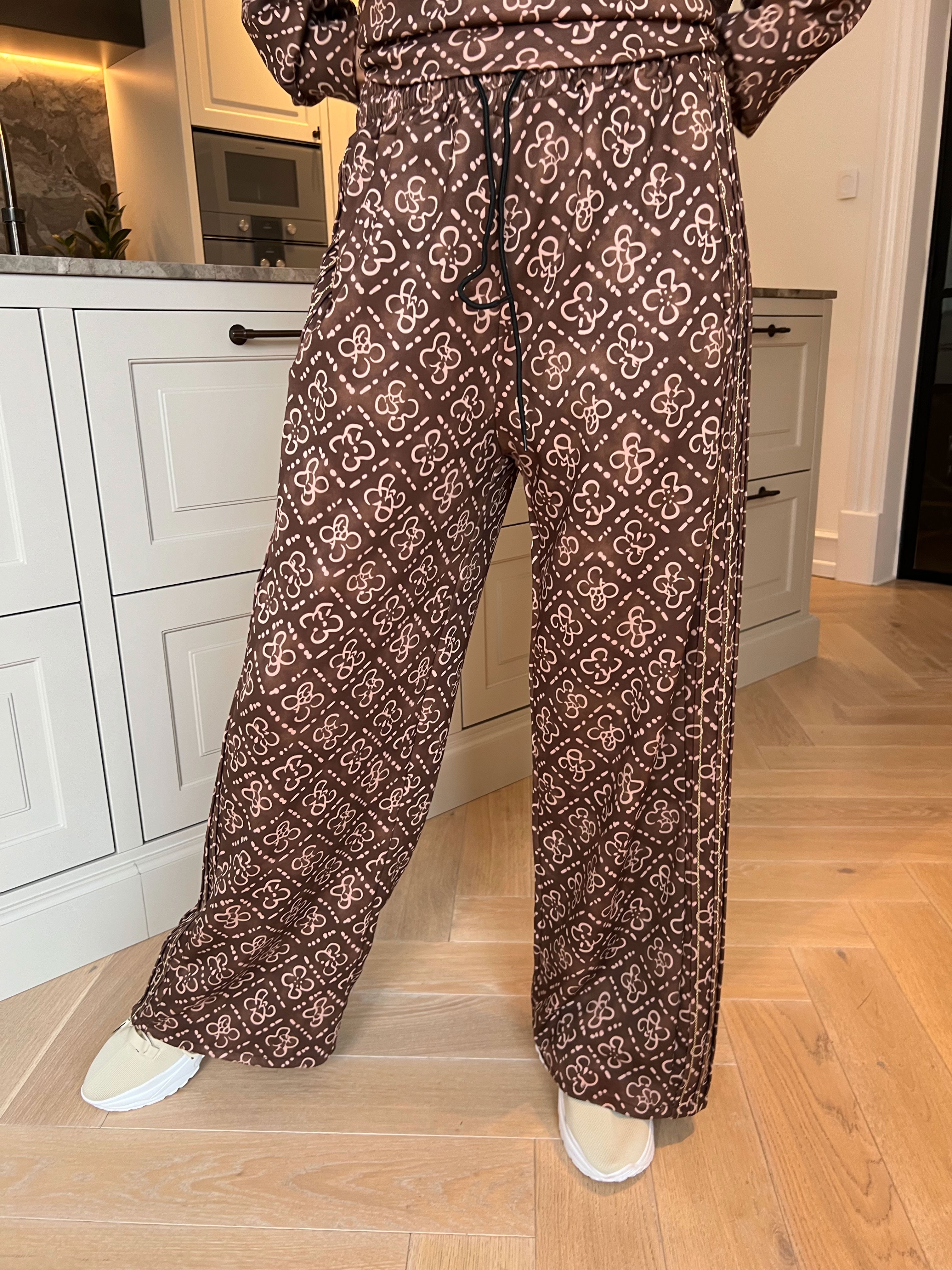 Dream Pattern - Träningsoverall i viskos med trendigt mönster, gulddetaljer och ribbade kanter