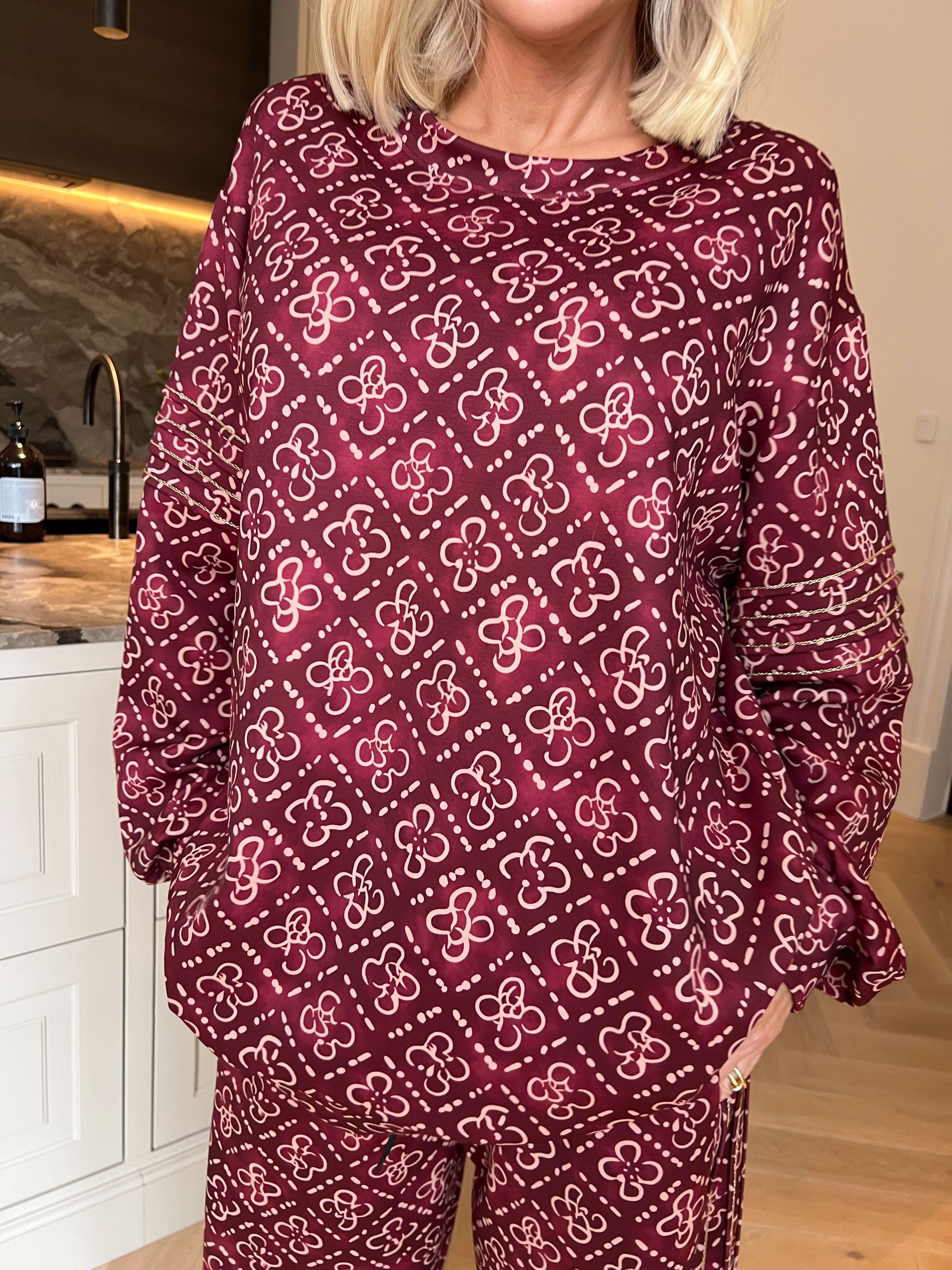 Dream Pattern - Träningsoverall i viskos med trendigt mönster, gulddetaljer och ribbade kanter