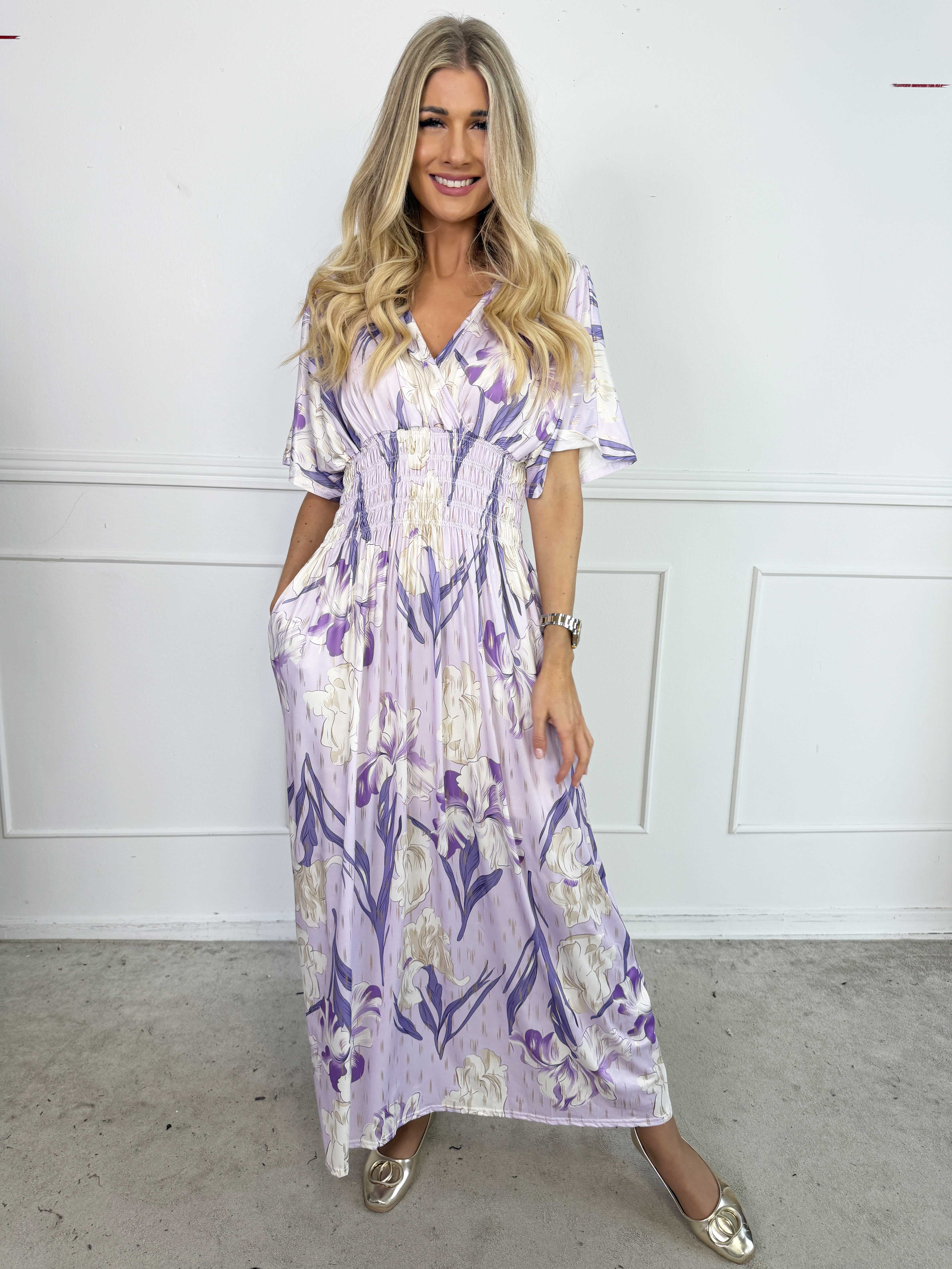 Pams Kvitka - Lång, stretchig blommig klänning med gulddetaljer och fickor