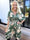 Pams New Leaf Short - Elastisk klänning med färgat blommönster och gulddetaljer