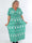 Pams Snow - Lång stretchig plus size-klänning med jultryck