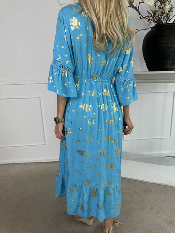 Pernilla - Klänning med guldfärgade blommor och broderier