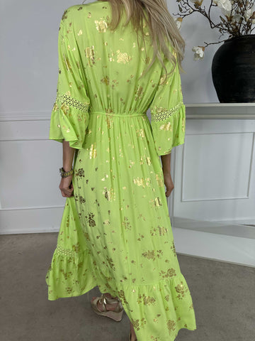 Pernilla - Klänning med guldfärgade blommor och broderier