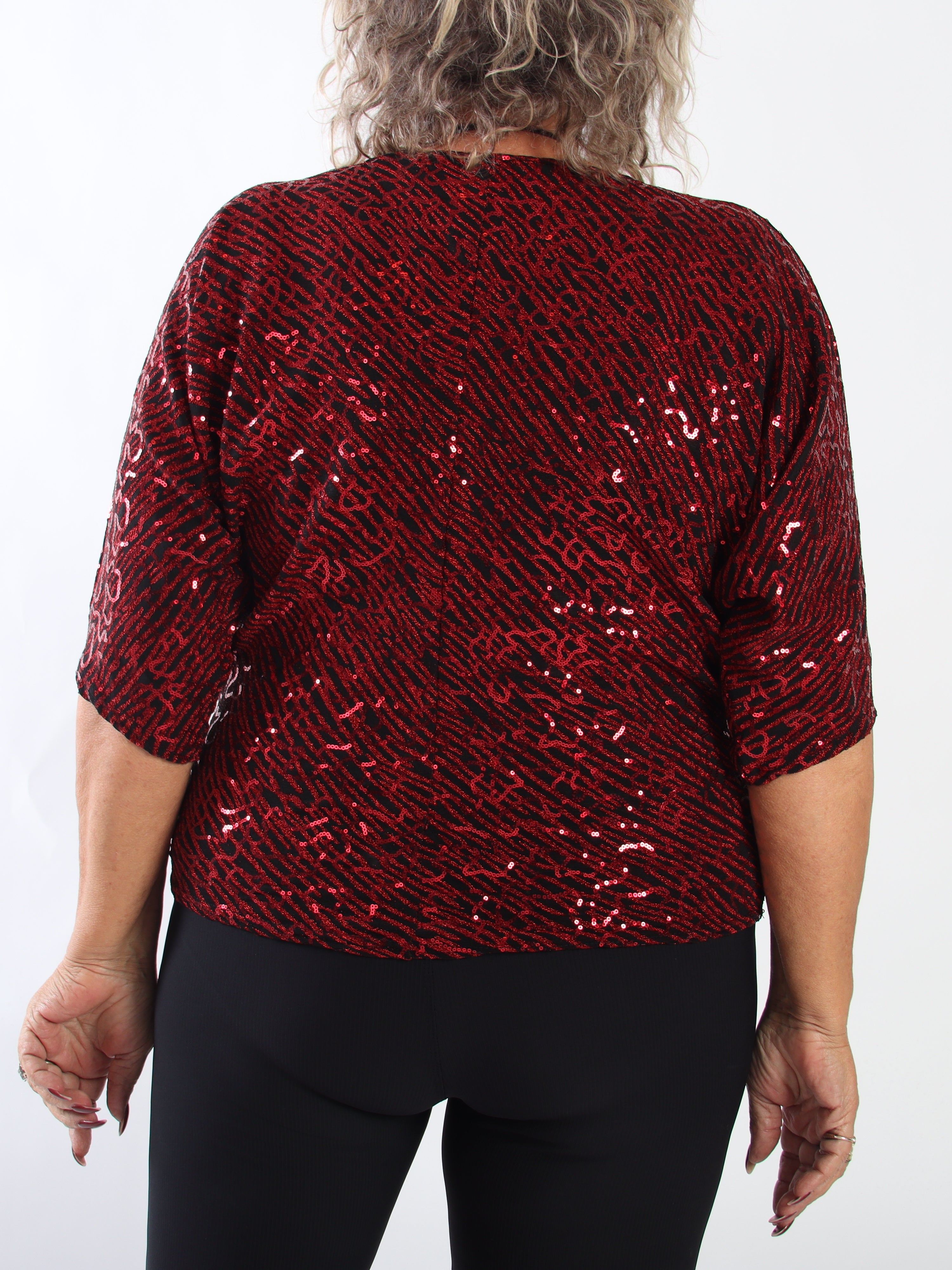 Kate - Tunika i plus size med glittrande trådar och fina paljetter som ger en glamorös look