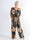 Pams Multi Leaf Jumpsuit - Jumpsuit med resår och bladmönster i stora storlekar