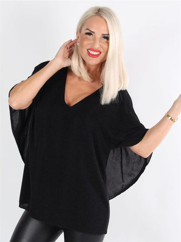 Jovana - Fin blus med fladdermusärmar och låg rygg