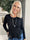 Krista - Blus i fin stickning med volangkant undertill - Black