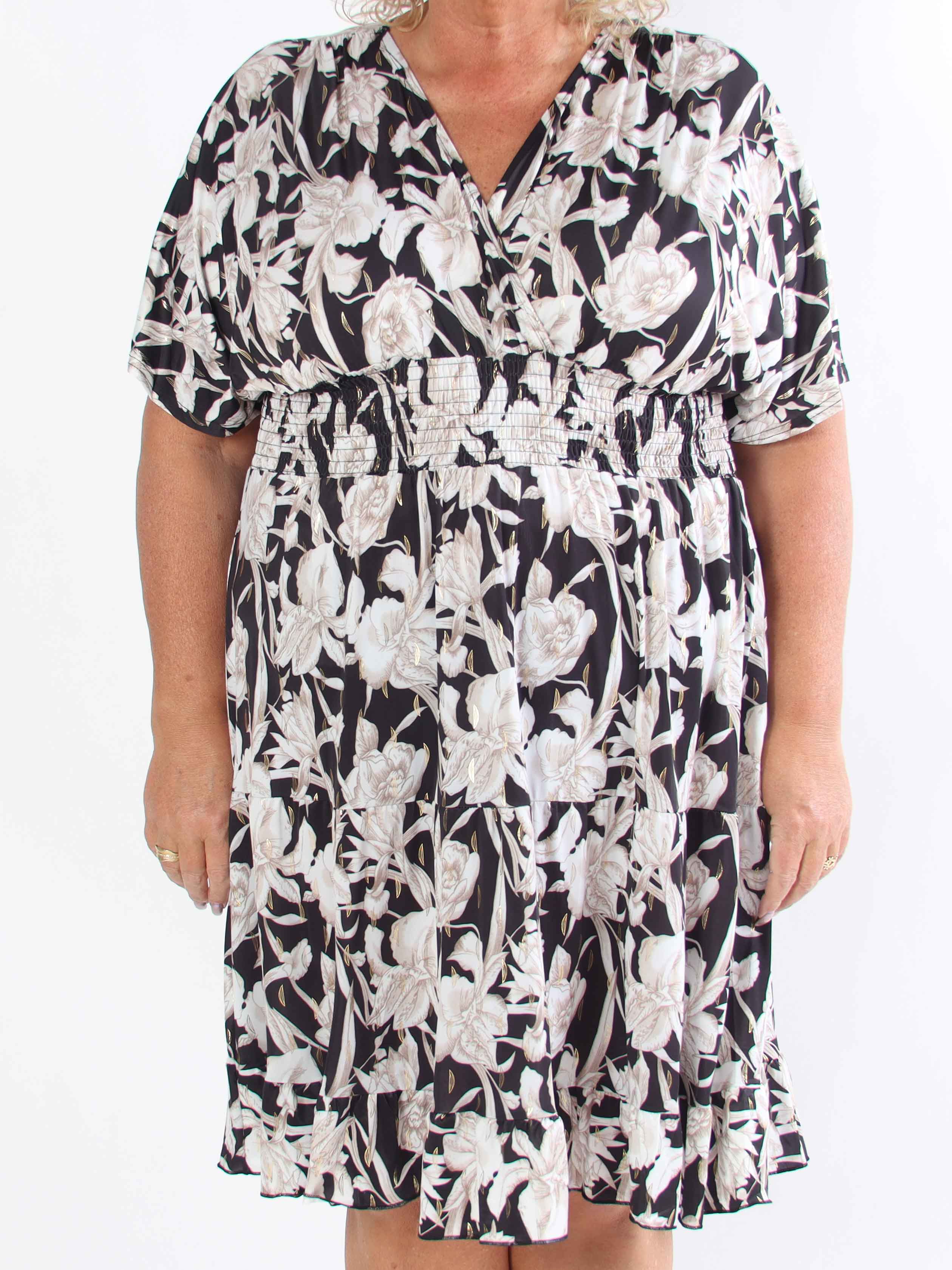 Angela - Klänning i plusstorlek med eleganta volanglager i kjolen