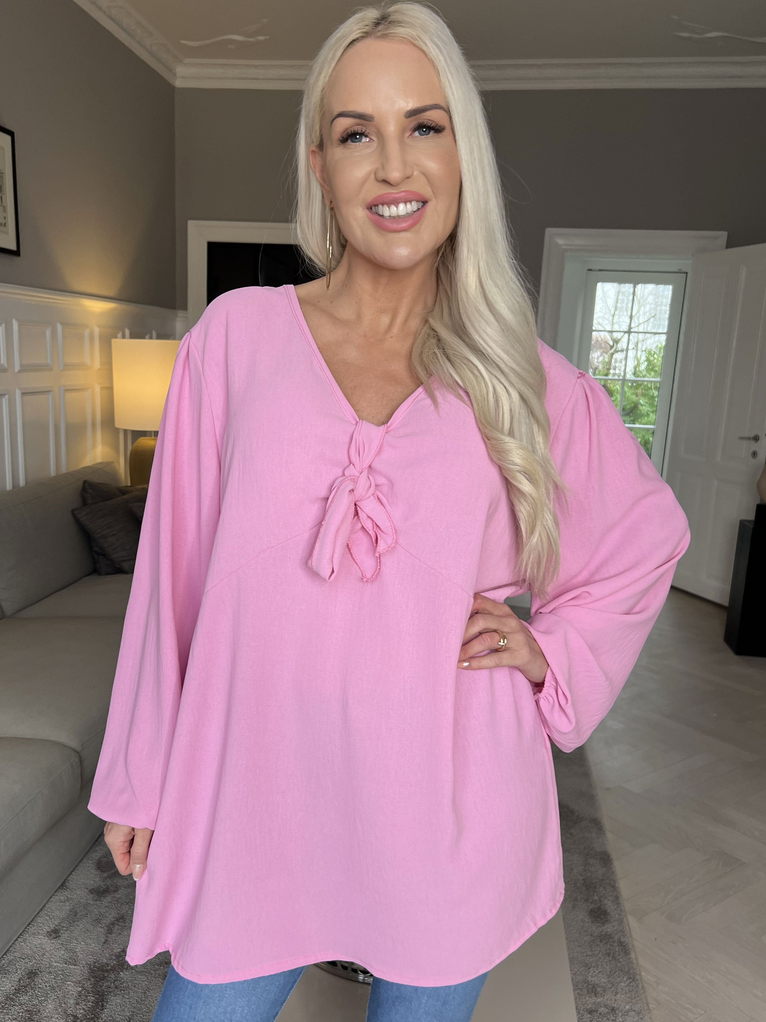 Cassandra - Söt tunika med rosett på bröstet