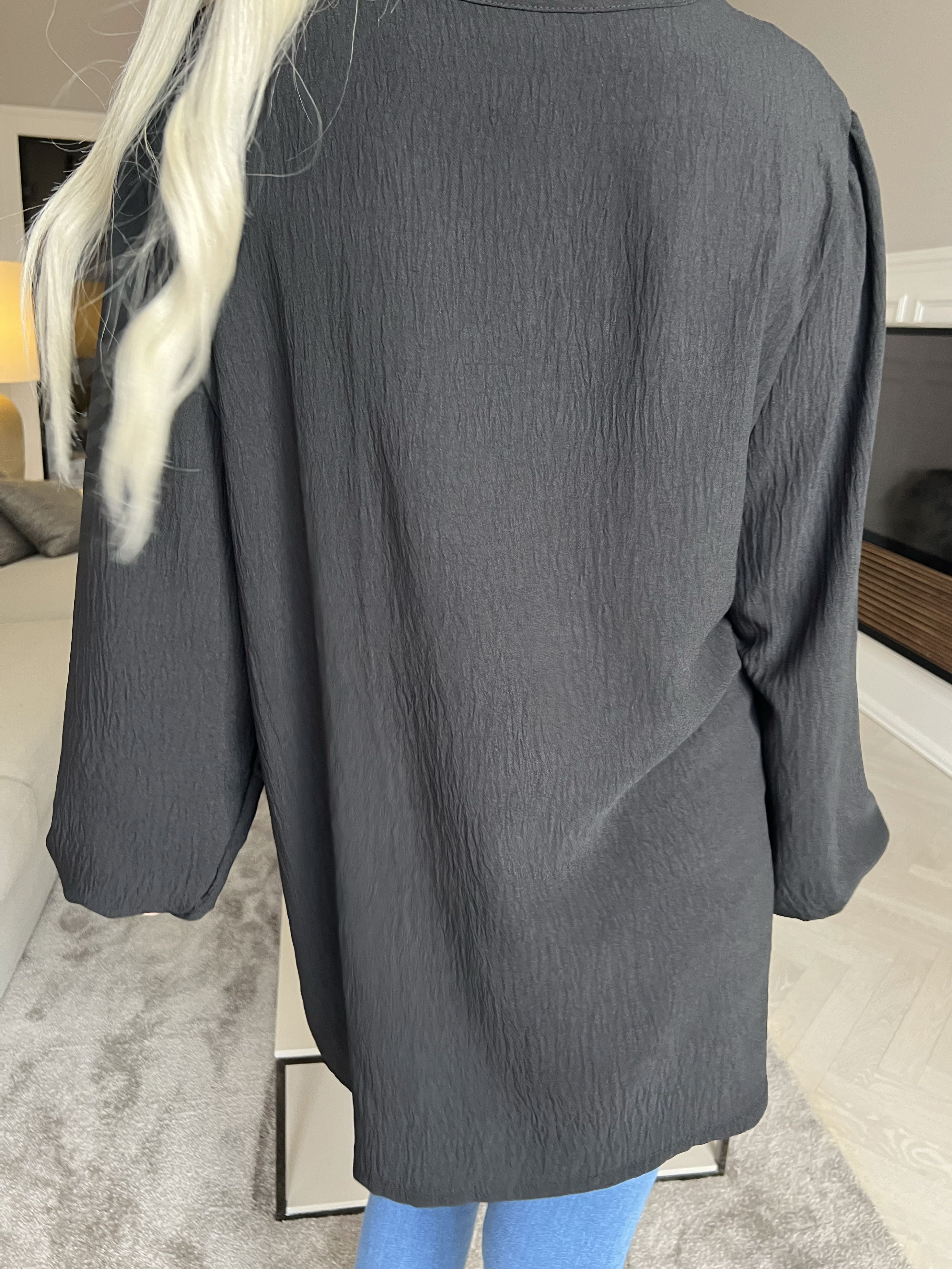 Cassandra - Söt tunika med rosett på bröstet