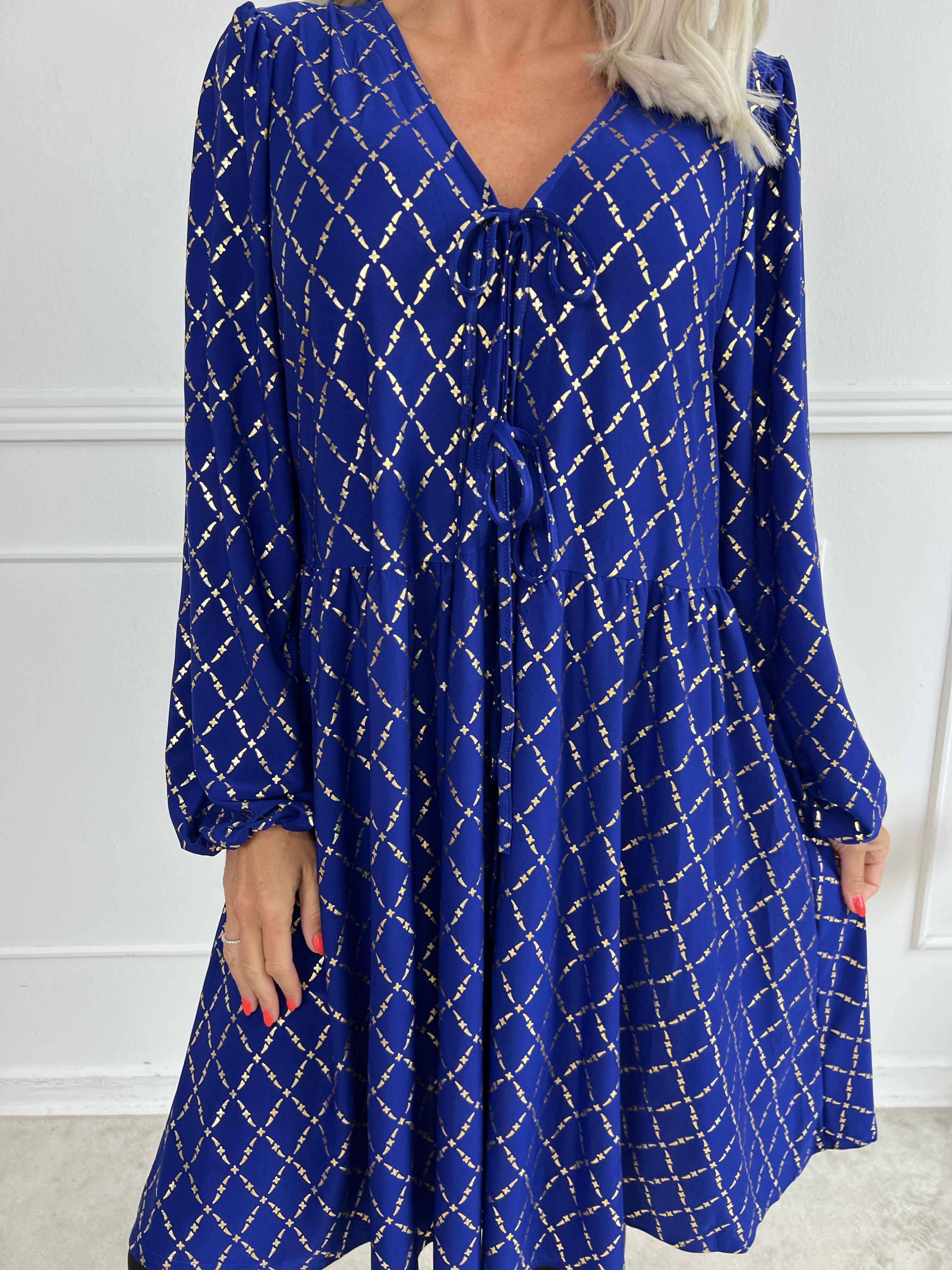 Cersei Gold Check - Babydoll klänning med guldfärgat mönster och rosetter