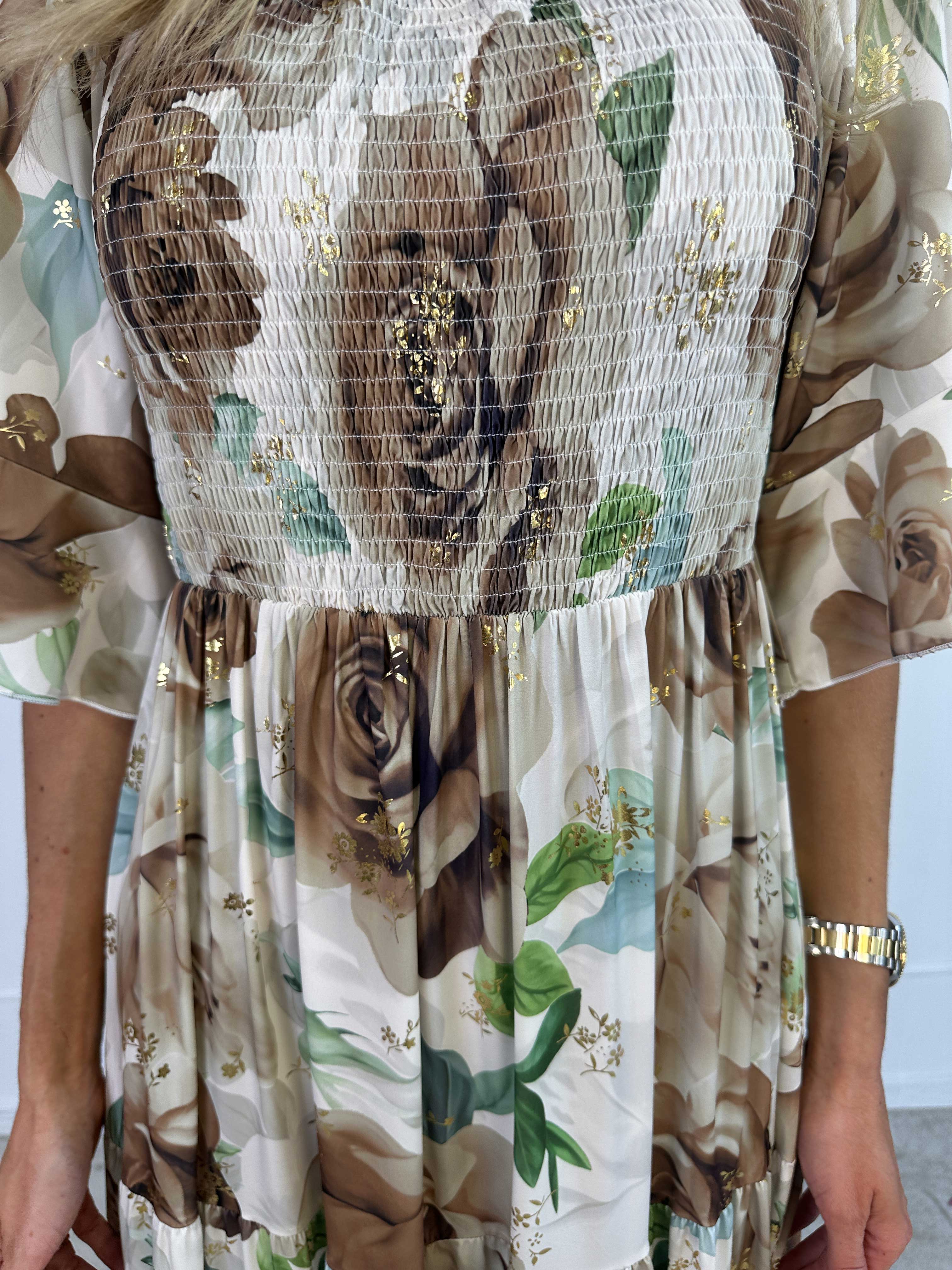 Elna Flower - Blommig elastisk klänning med resår över bysten