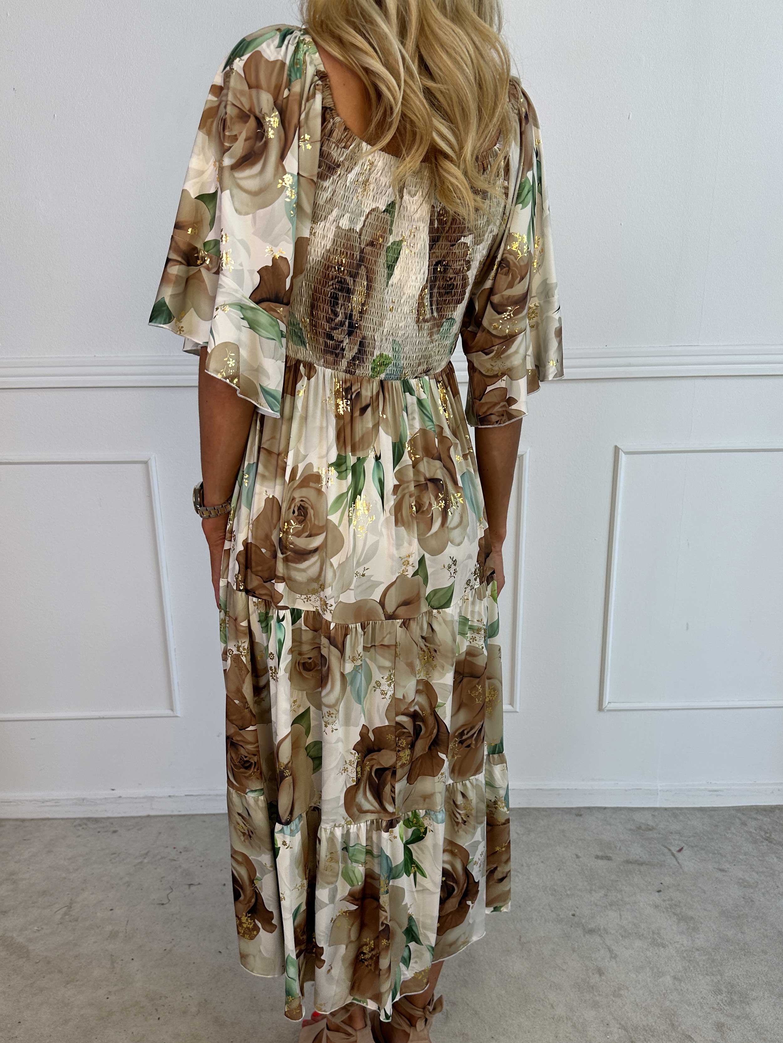 Elna Flower - Blommig elastisk klänning med resår över bysten