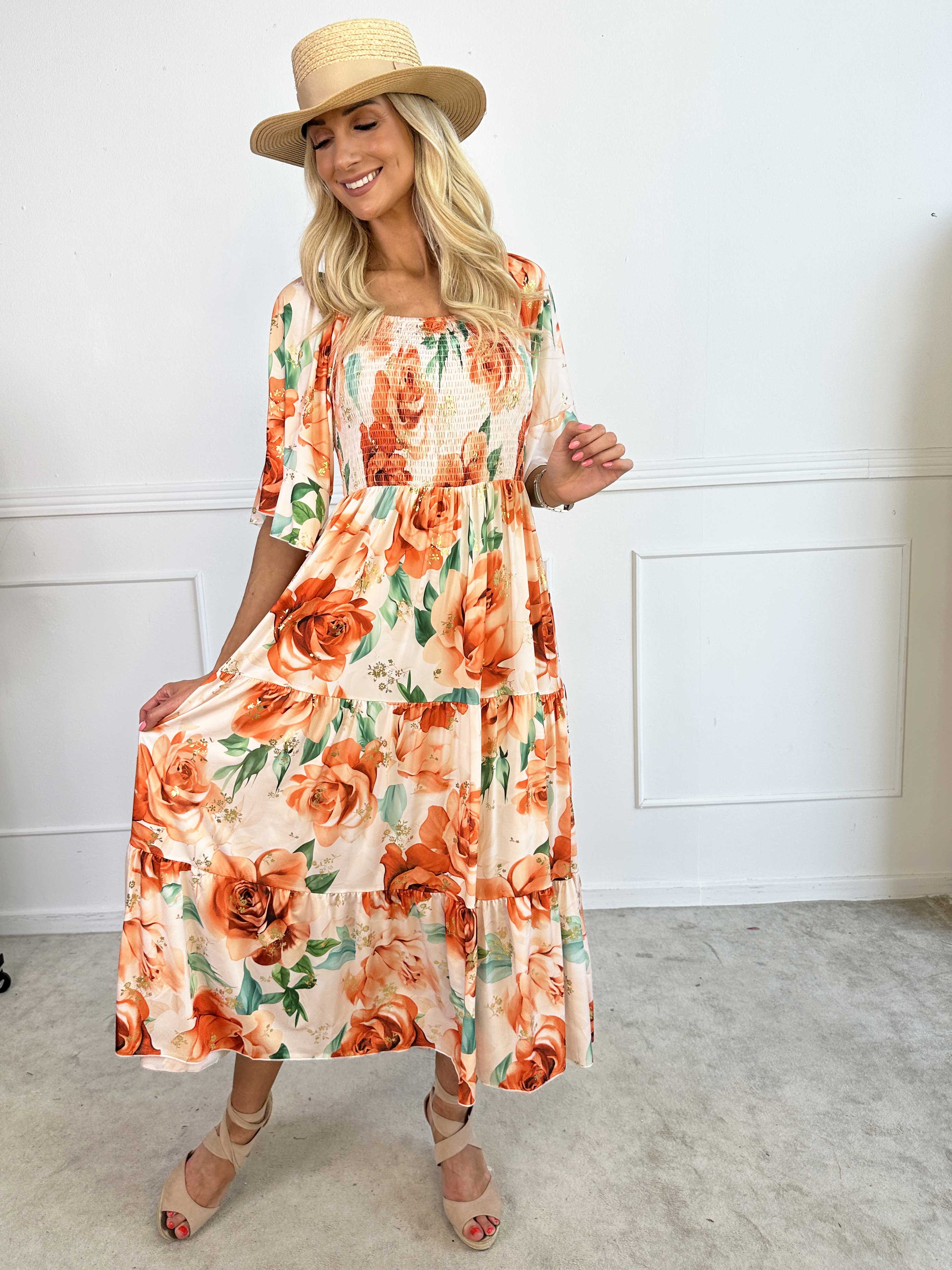 Elna Flower - Blommig elastisk klänning med resår över bysten