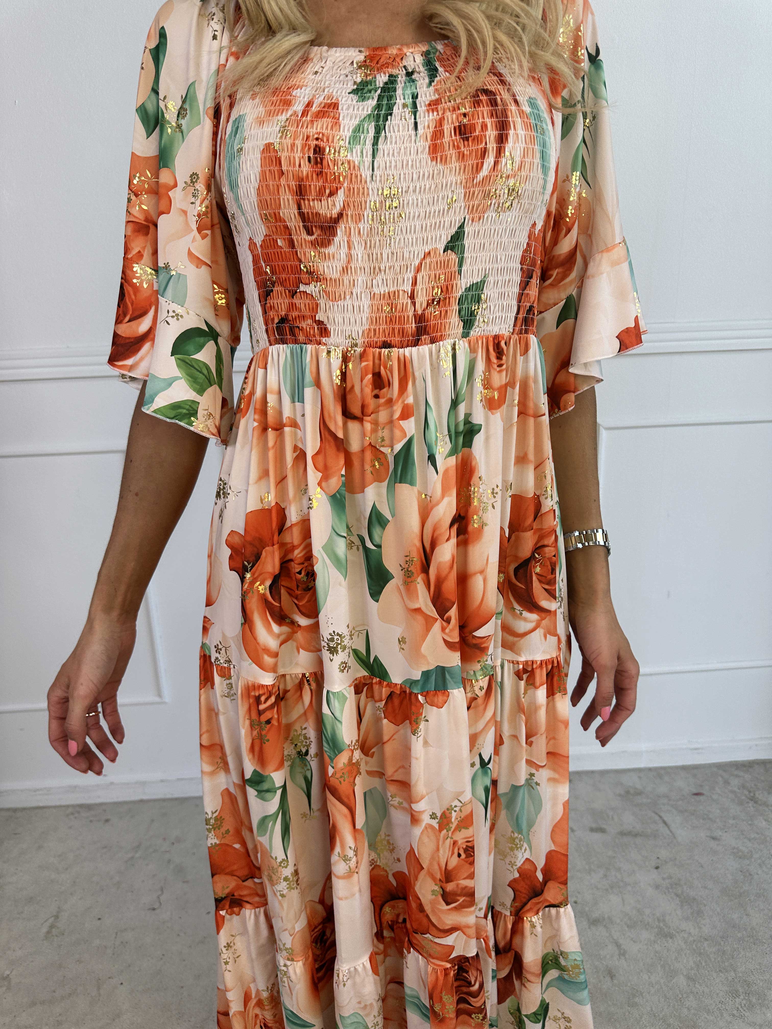 Elna Flower - Blommig elastisk klänning med resår över bysten