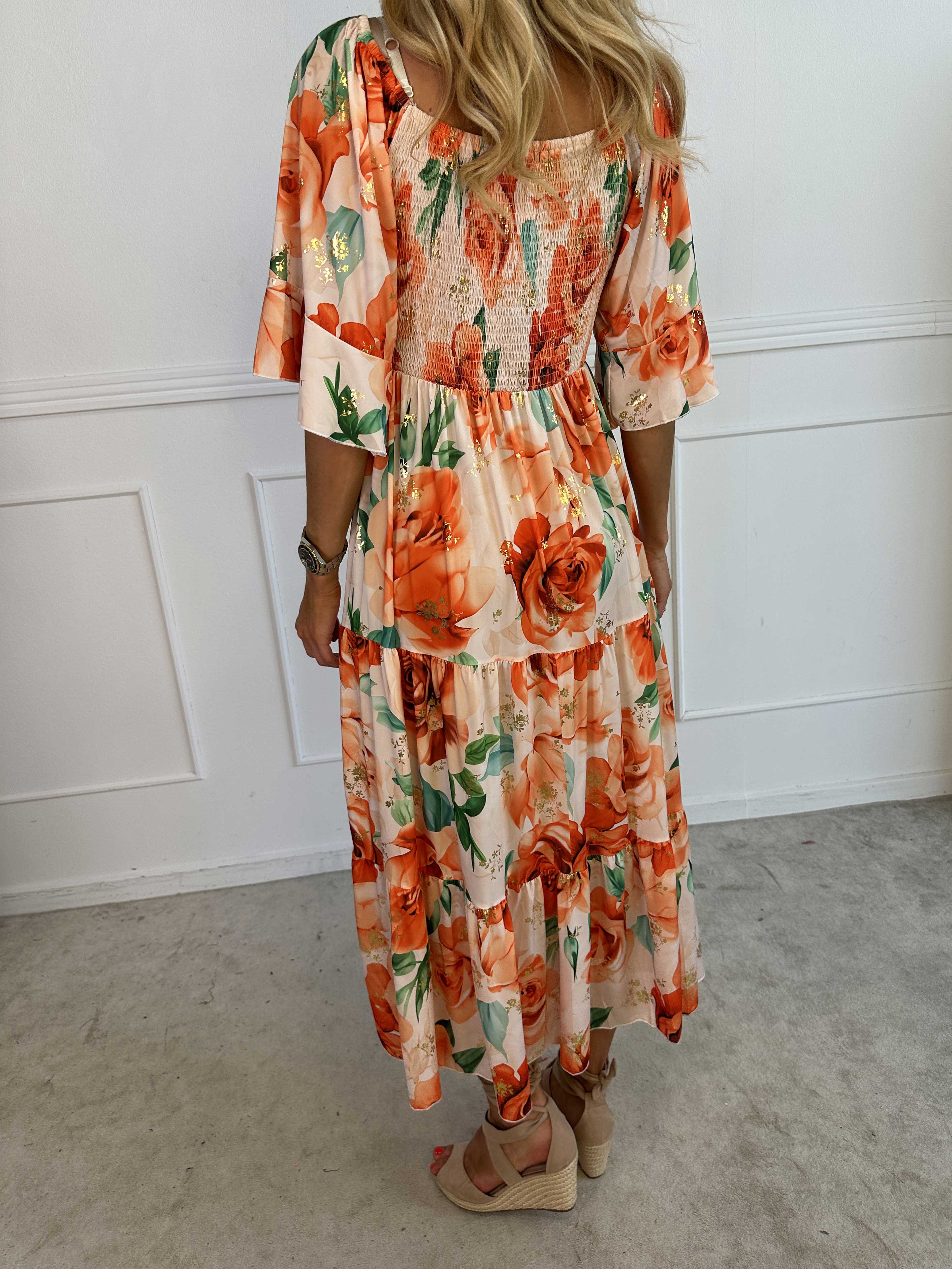 Elna Flower - Blommig elastisk klänning med resår över bysten