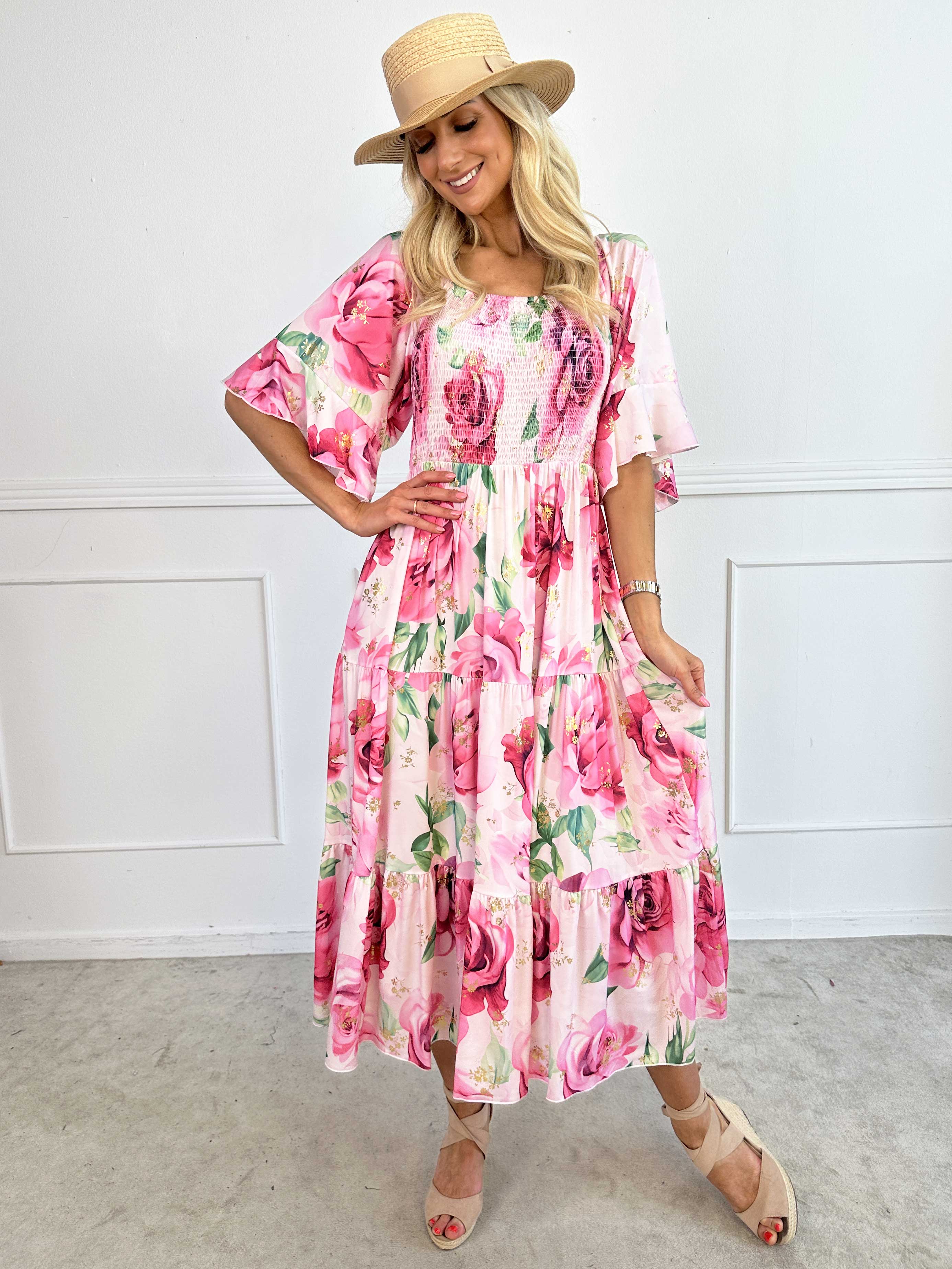 Elna Flower - Blommig elastisk klänning med resår över bysten