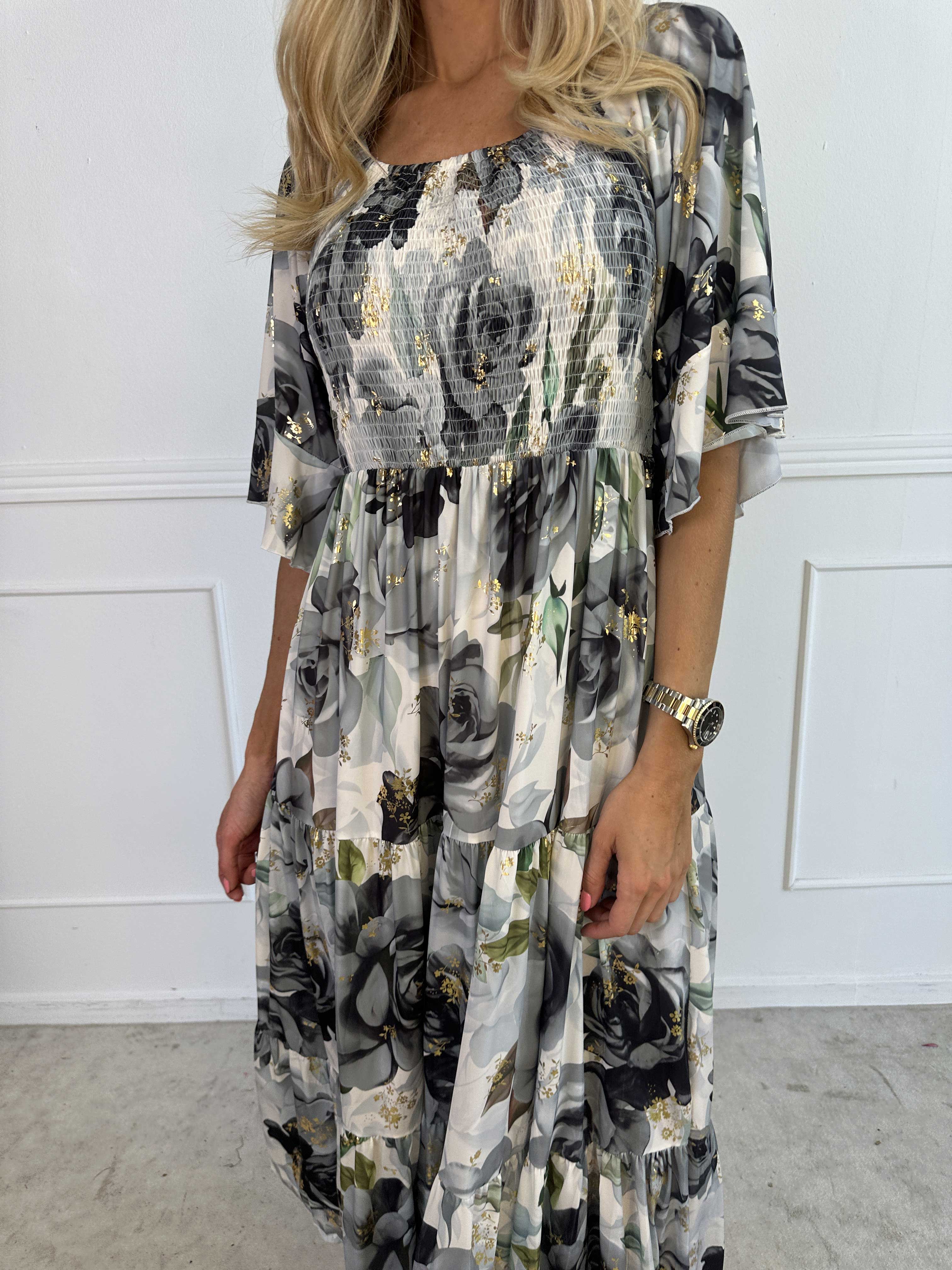 Elna Flower - Blommig elastisk klänning med resår över bysten