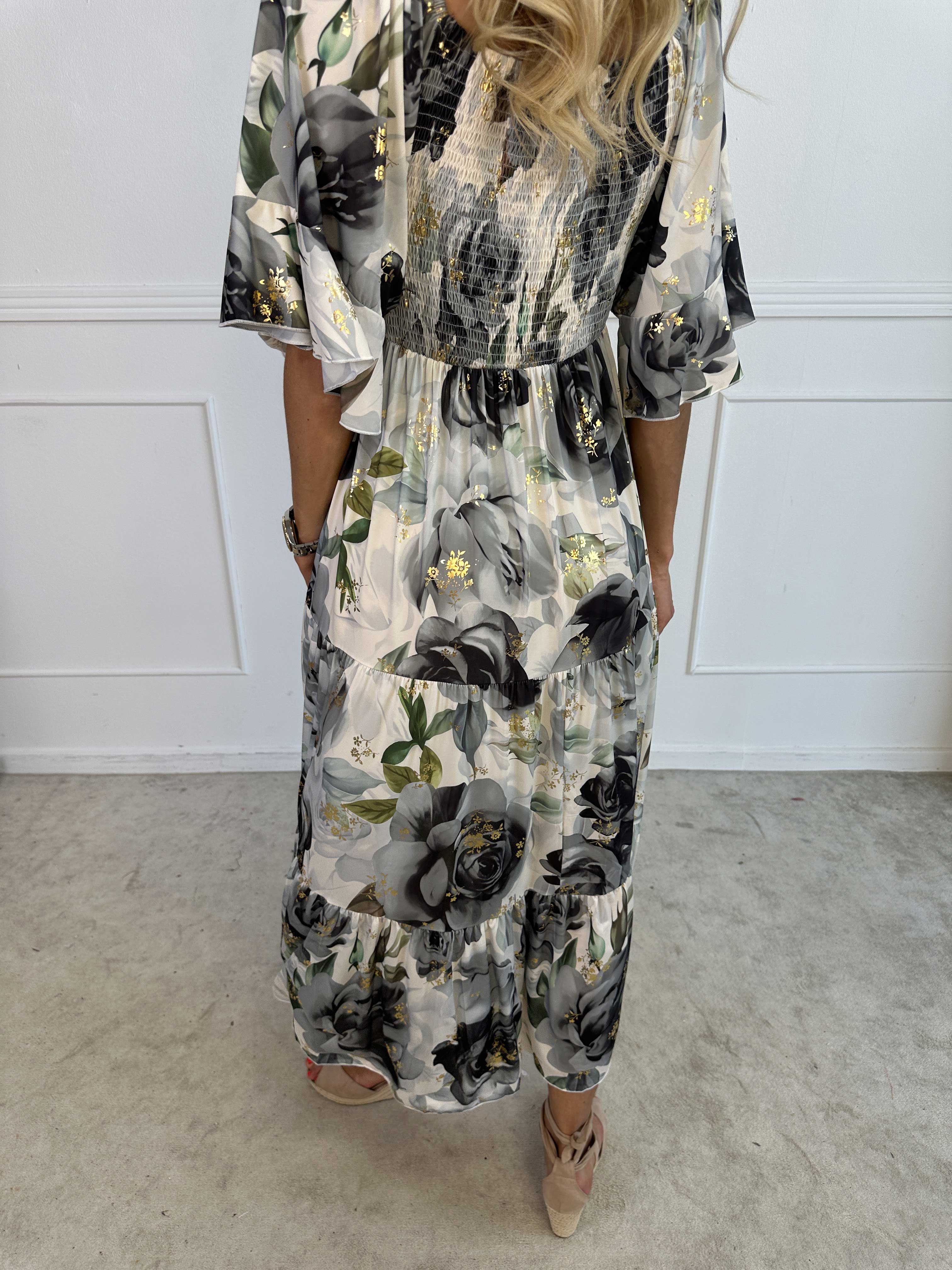 Elna Flower - Blommig elastisk klänning med resår över bysten