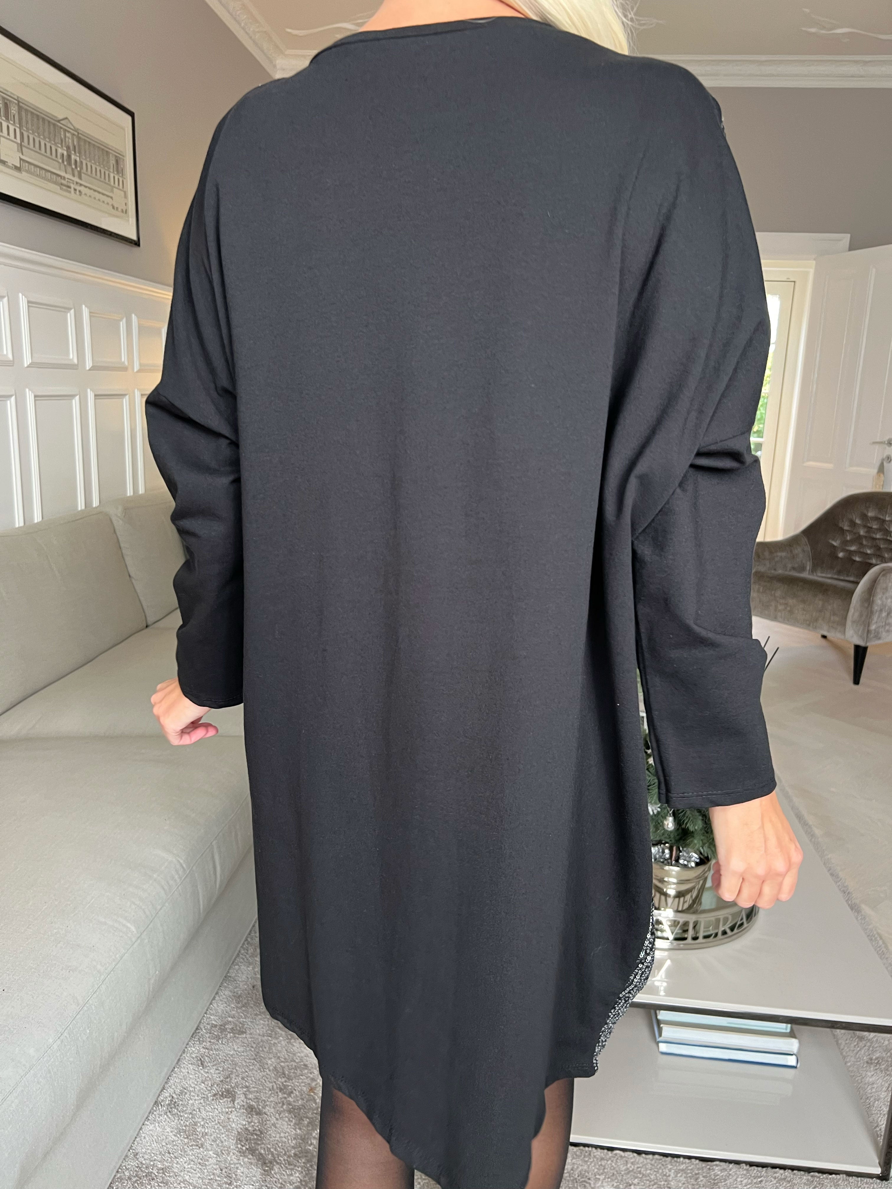 Eria - Klänning med paljetter på framsidan