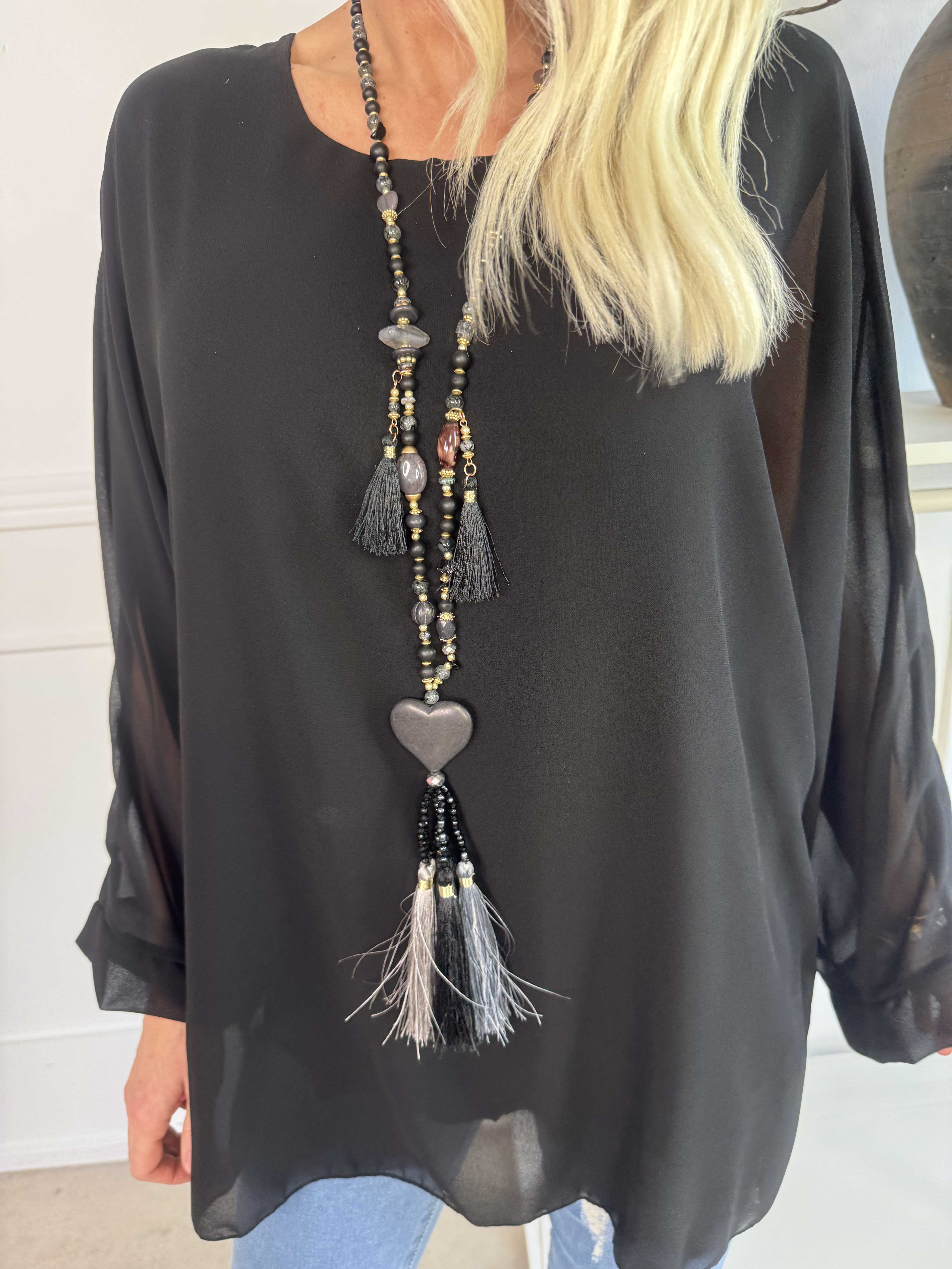 Flores - Tunika med chiffonglager och halvgenomskinliga ärmar