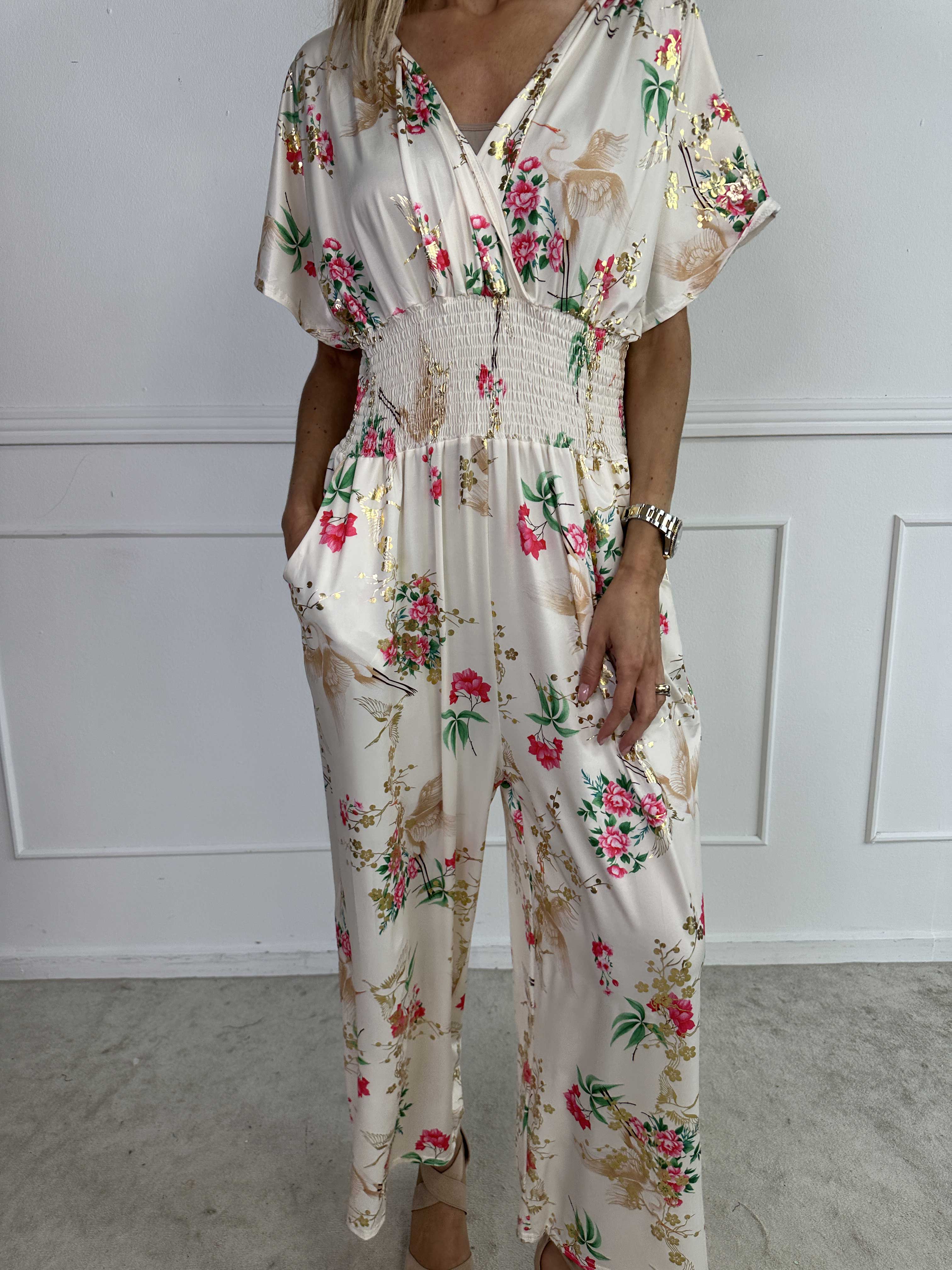 Pams Fly Jumpsuit - Elastisk byxdress med blommor- och fågelmönster