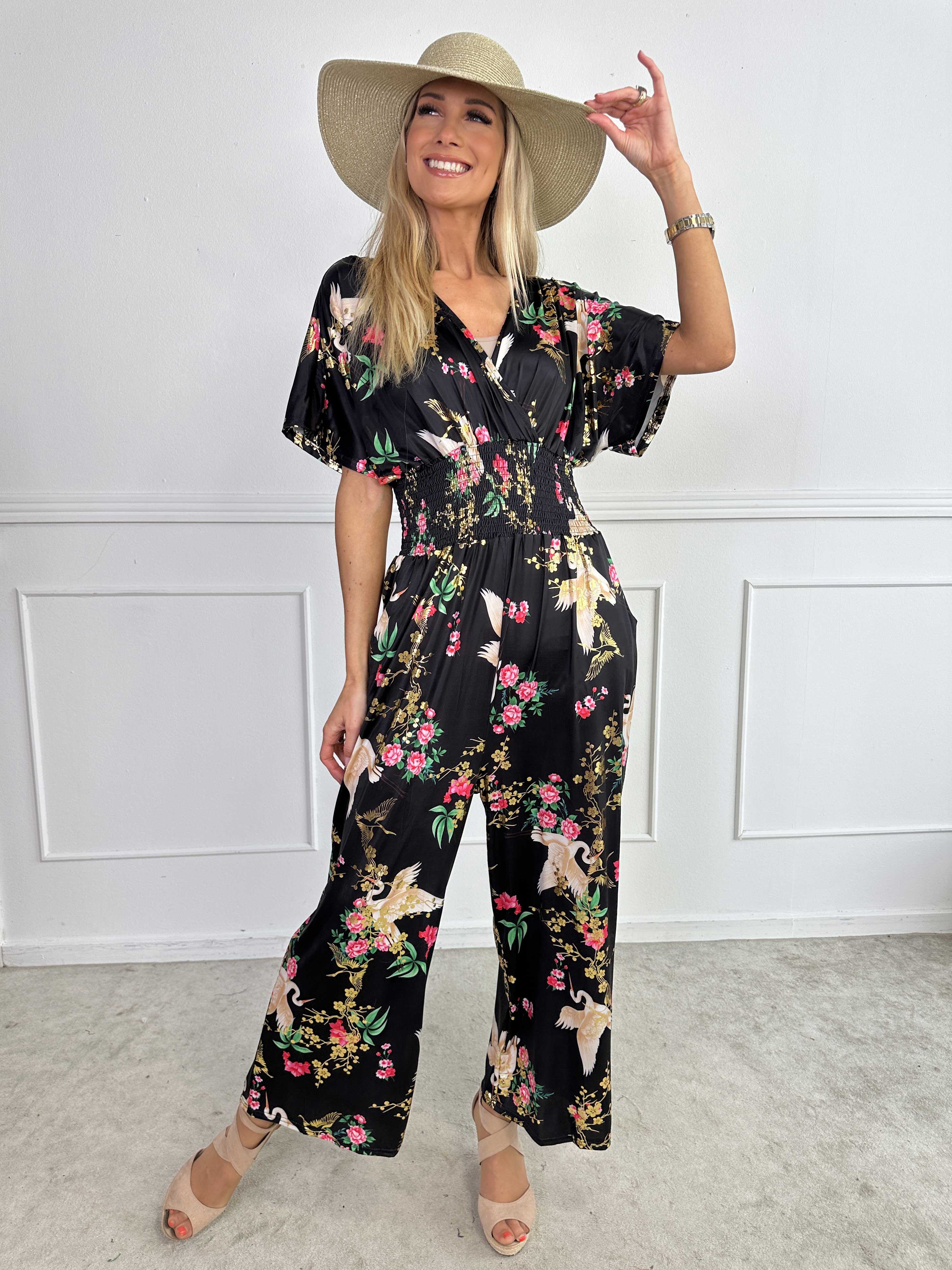 Pams Fly Jumpsuit - Elastisk byxdress med blommor- och fågelmönster