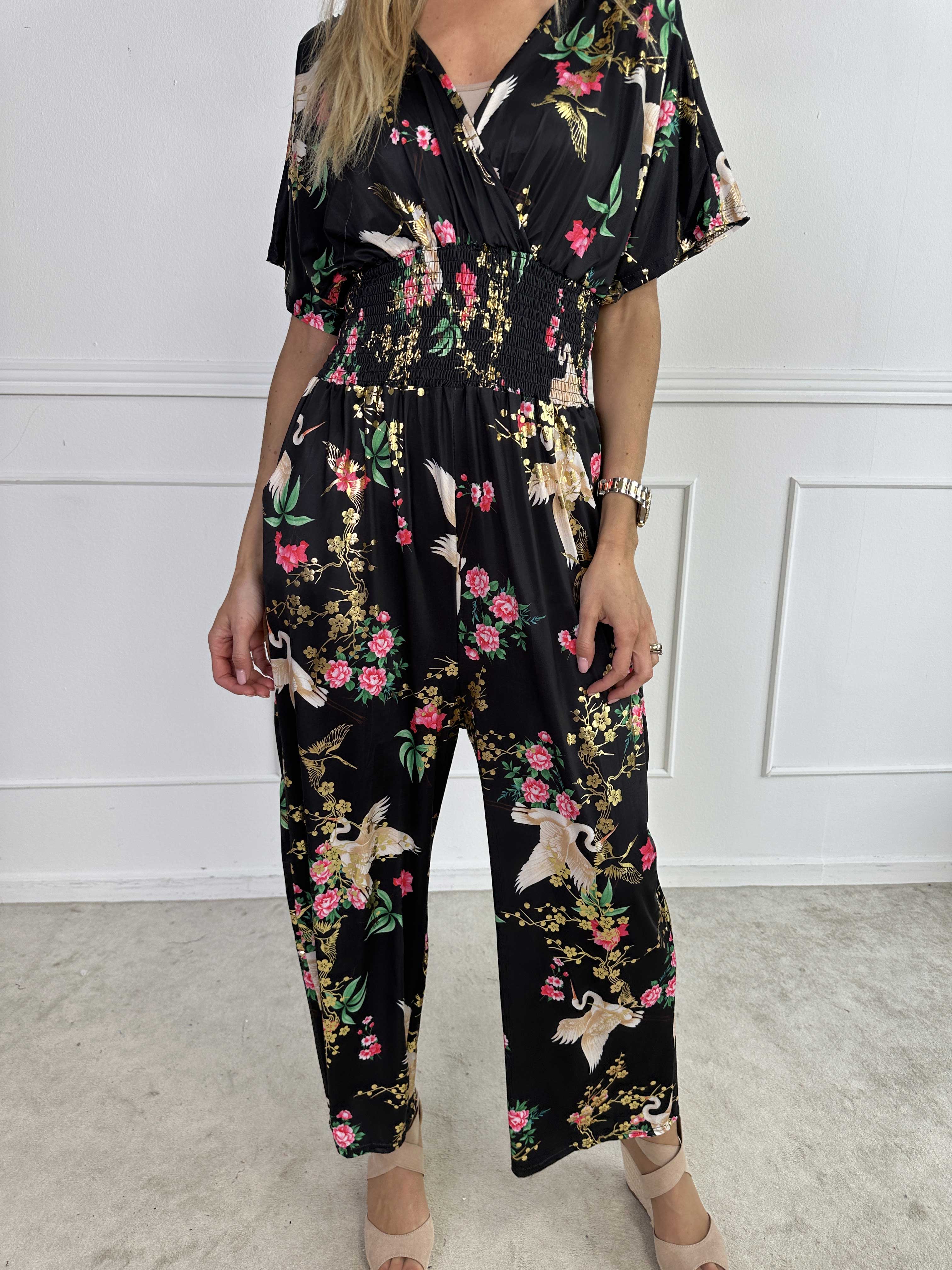 Pams Fly Jumpsuit - Elastisk byxdress med blommor- och fågelmönster