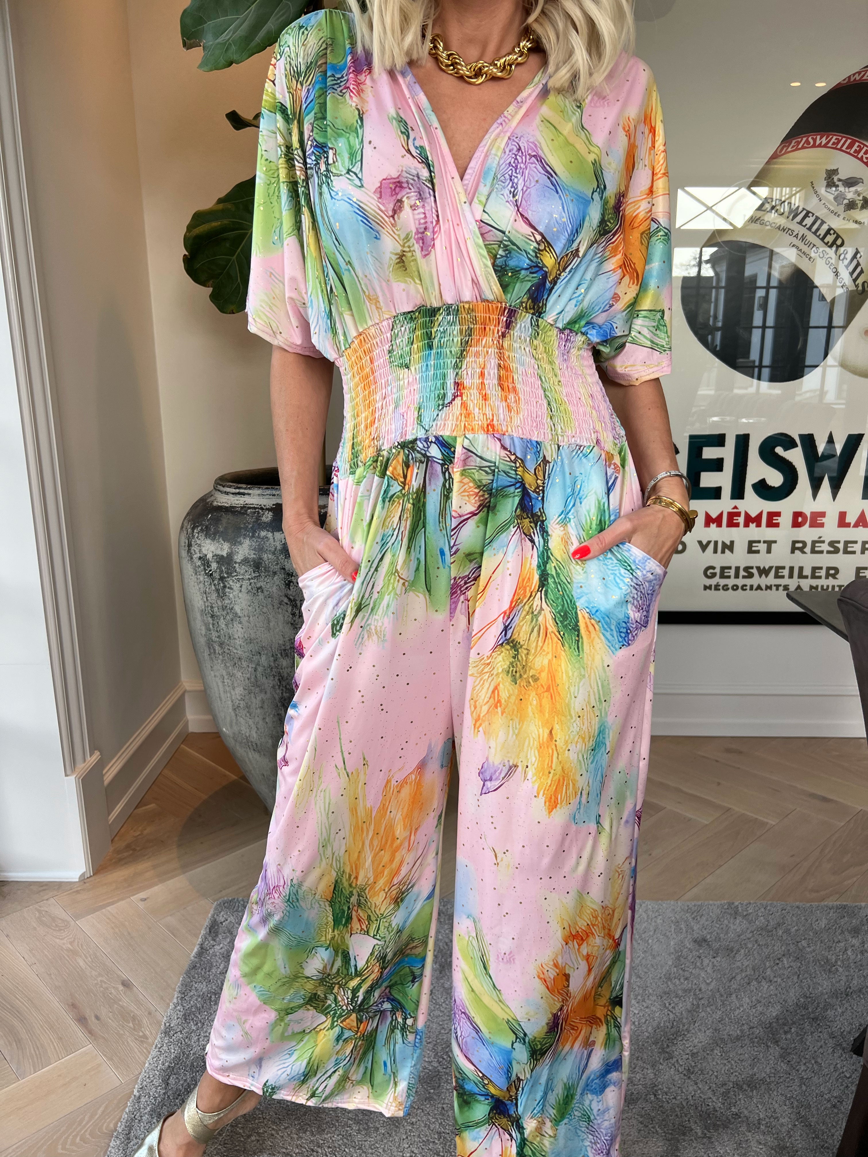 Pams Print Jumpsuit - Stretchig mönstrad jumpsuit med guldfärgat damm