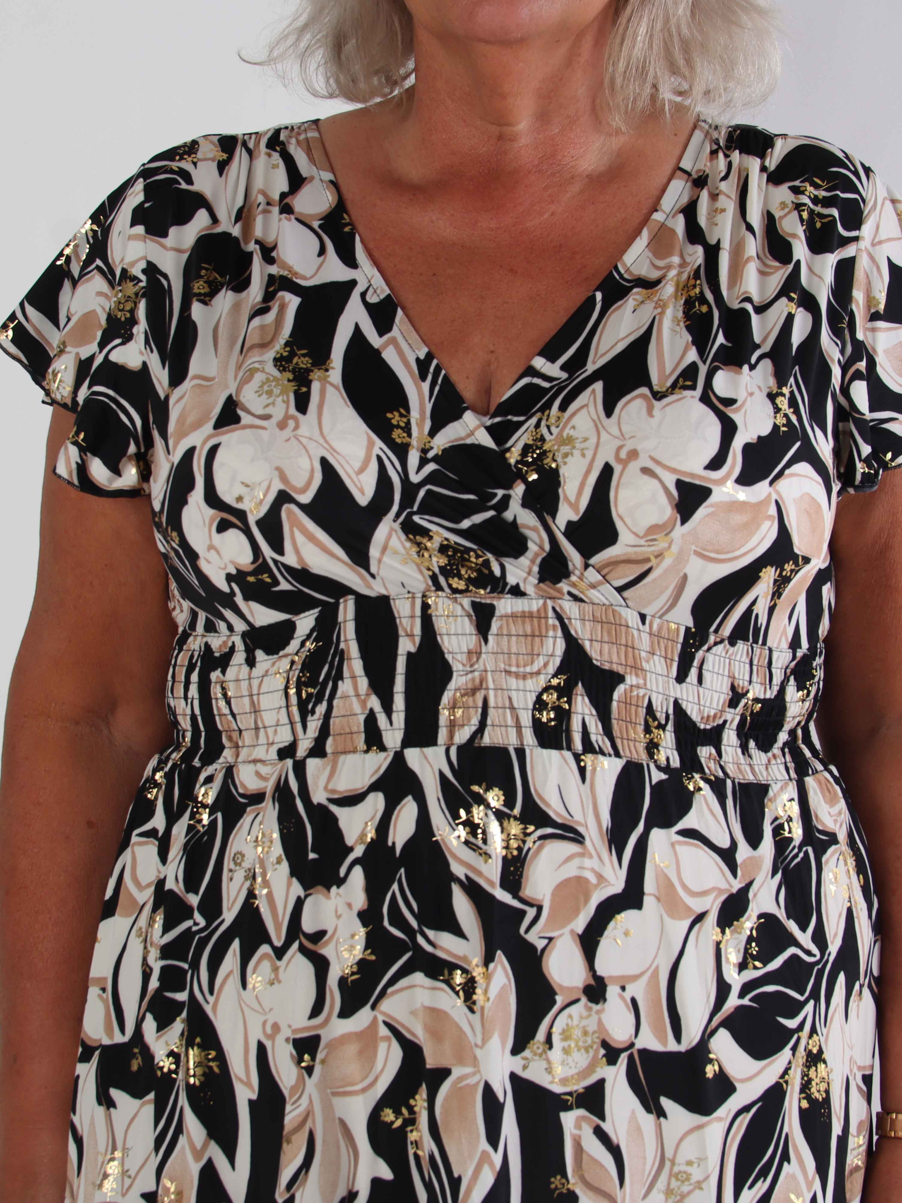 Palmira - Mönstrad elastisk plus size klänning med lager på lager look