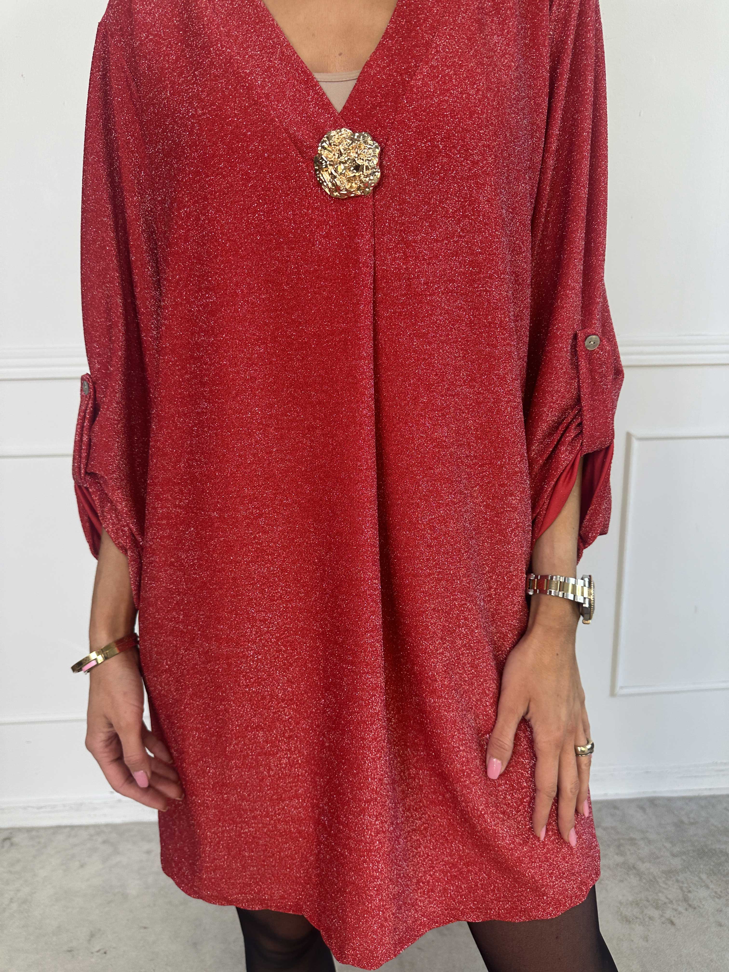 Betty - Söt glittrig tunikaklänning med guldbrosch