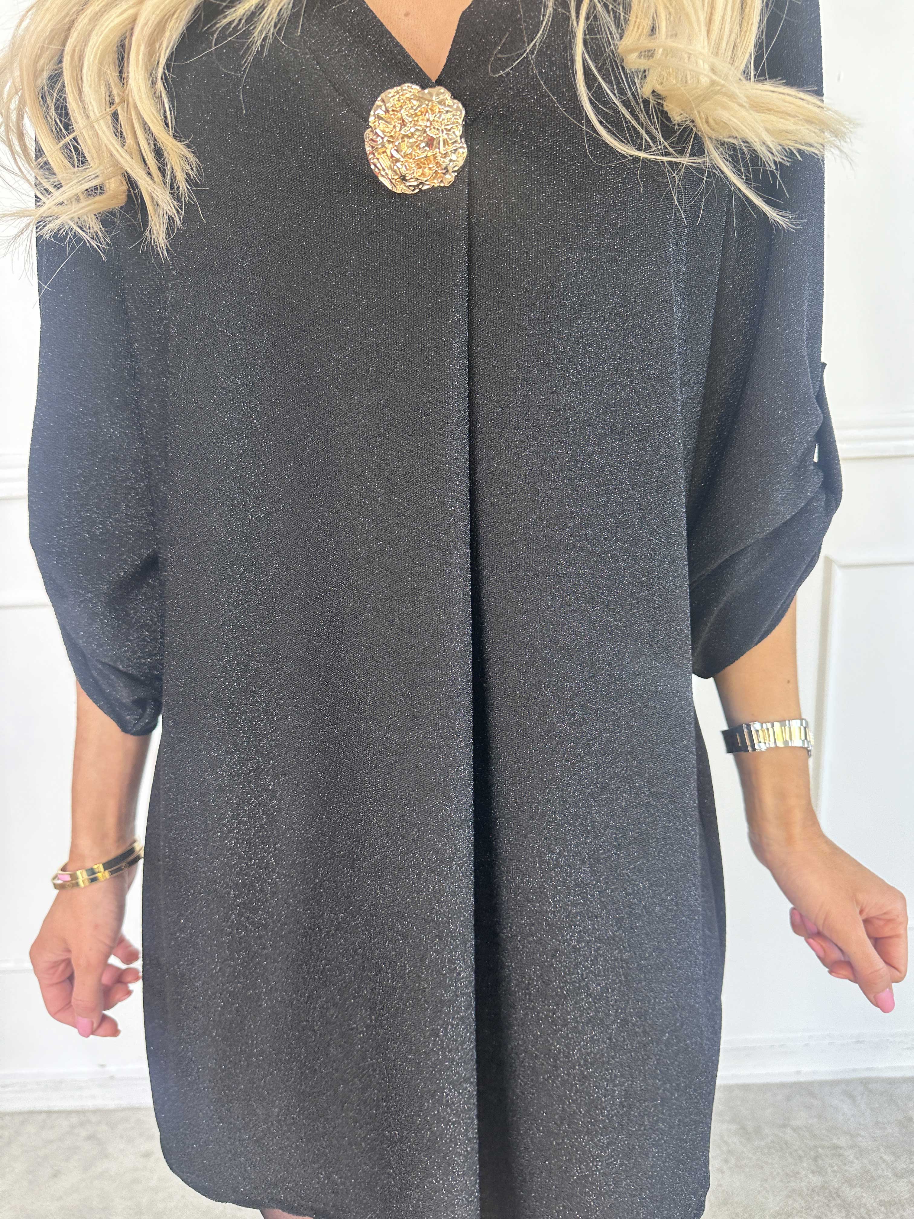 Betty - Söt glittrig tunikaklänning med guldbrosch