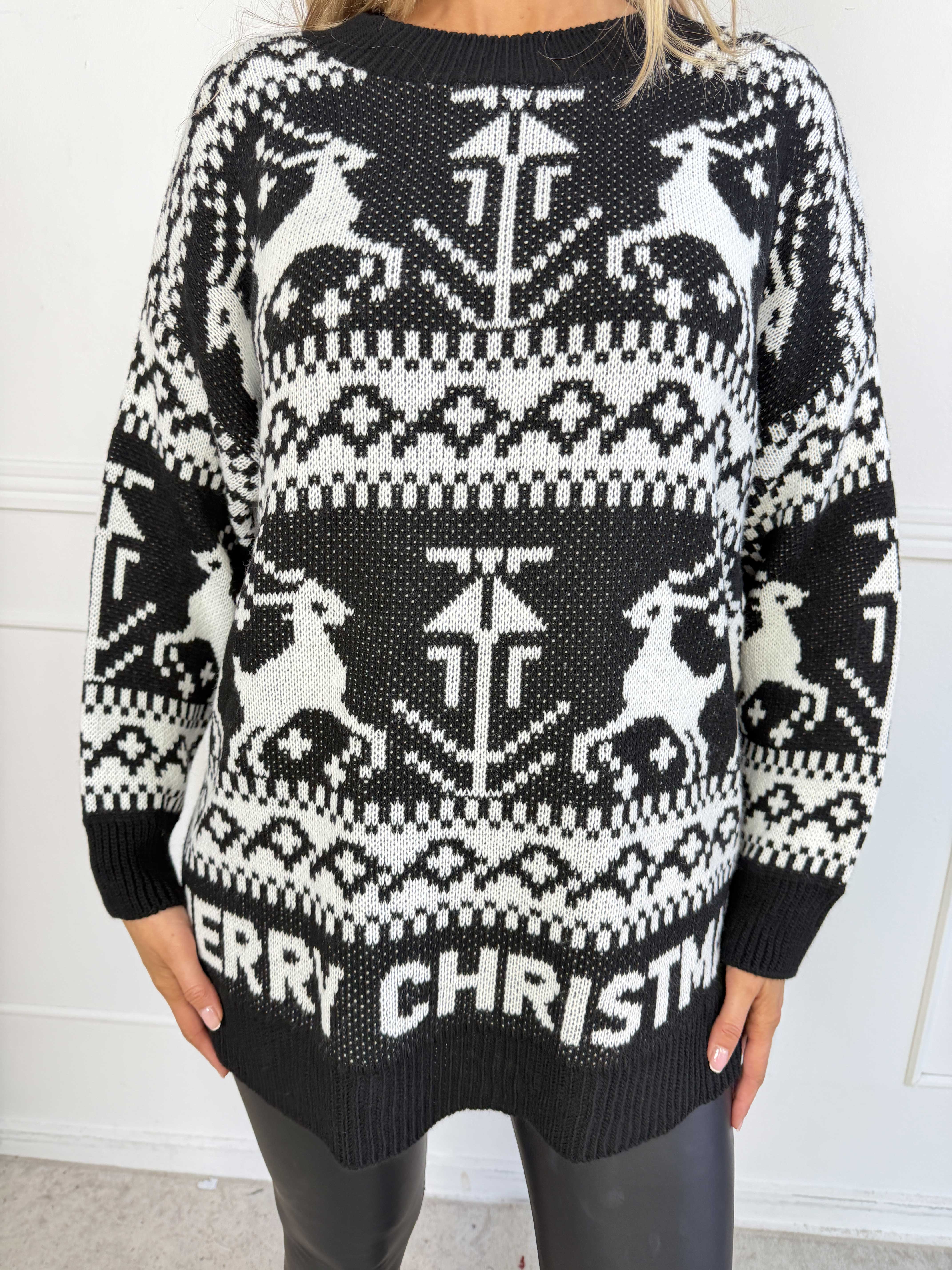 Jingle - Söt och mysig stickad jultröja med fina renar och texten “MERRY CHRISTMAS”