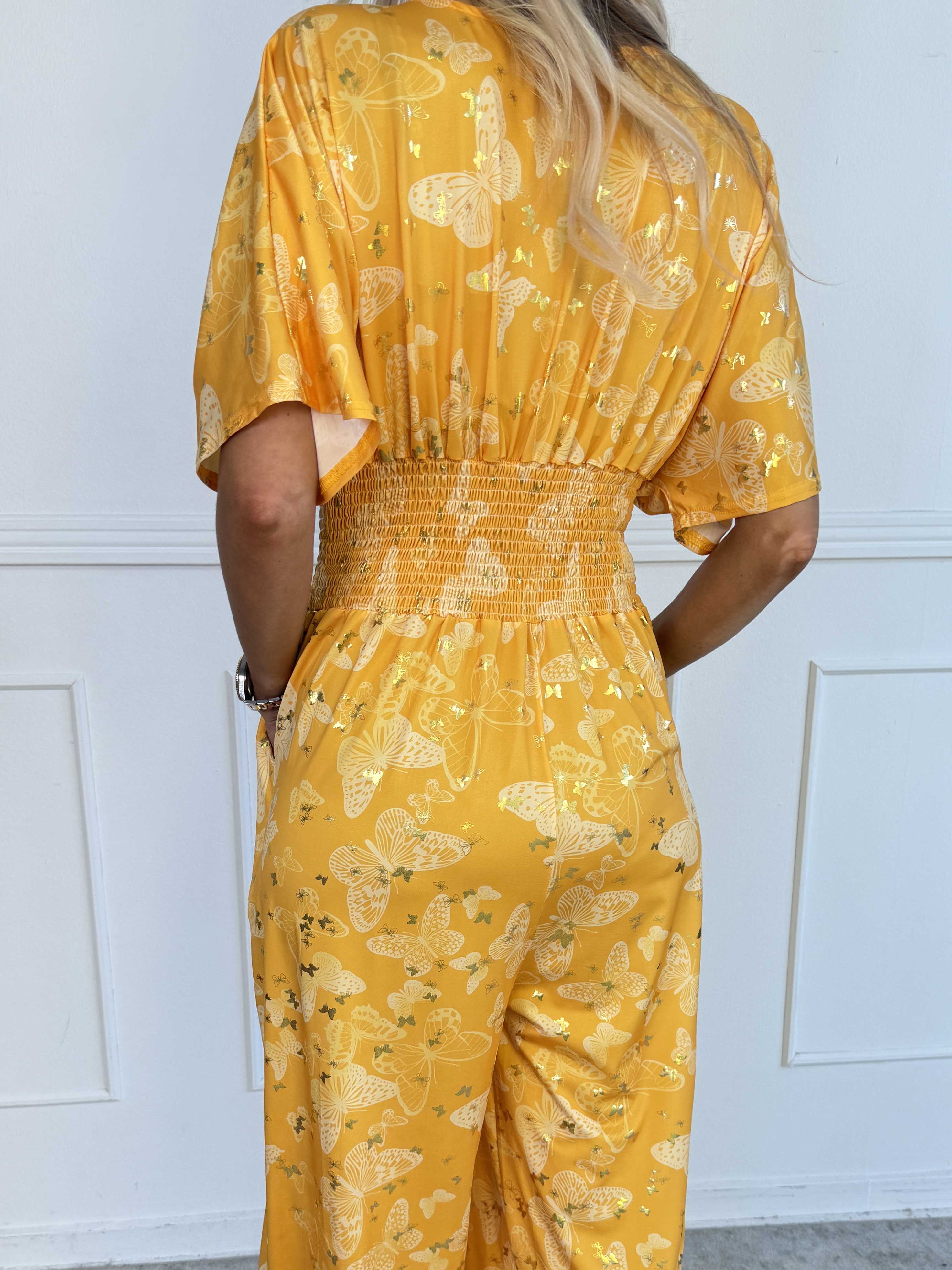 Pams Butterfly Jumpsuit - Elastisk plus size jumpsuit med fjärilsmönster