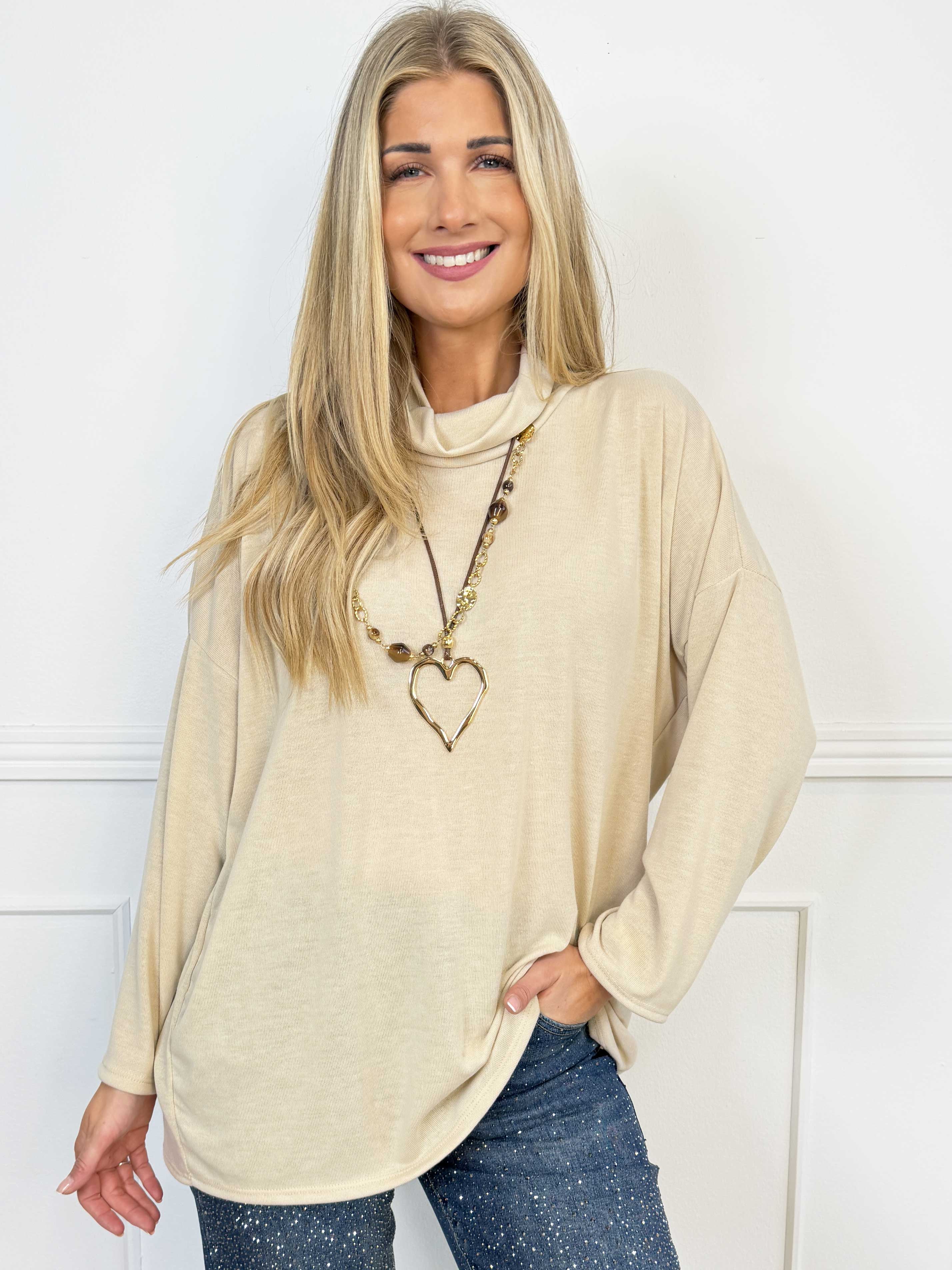 Ida - Mjuk och lätt stickad tröja i viskos med elegant hög hals och en stilren look