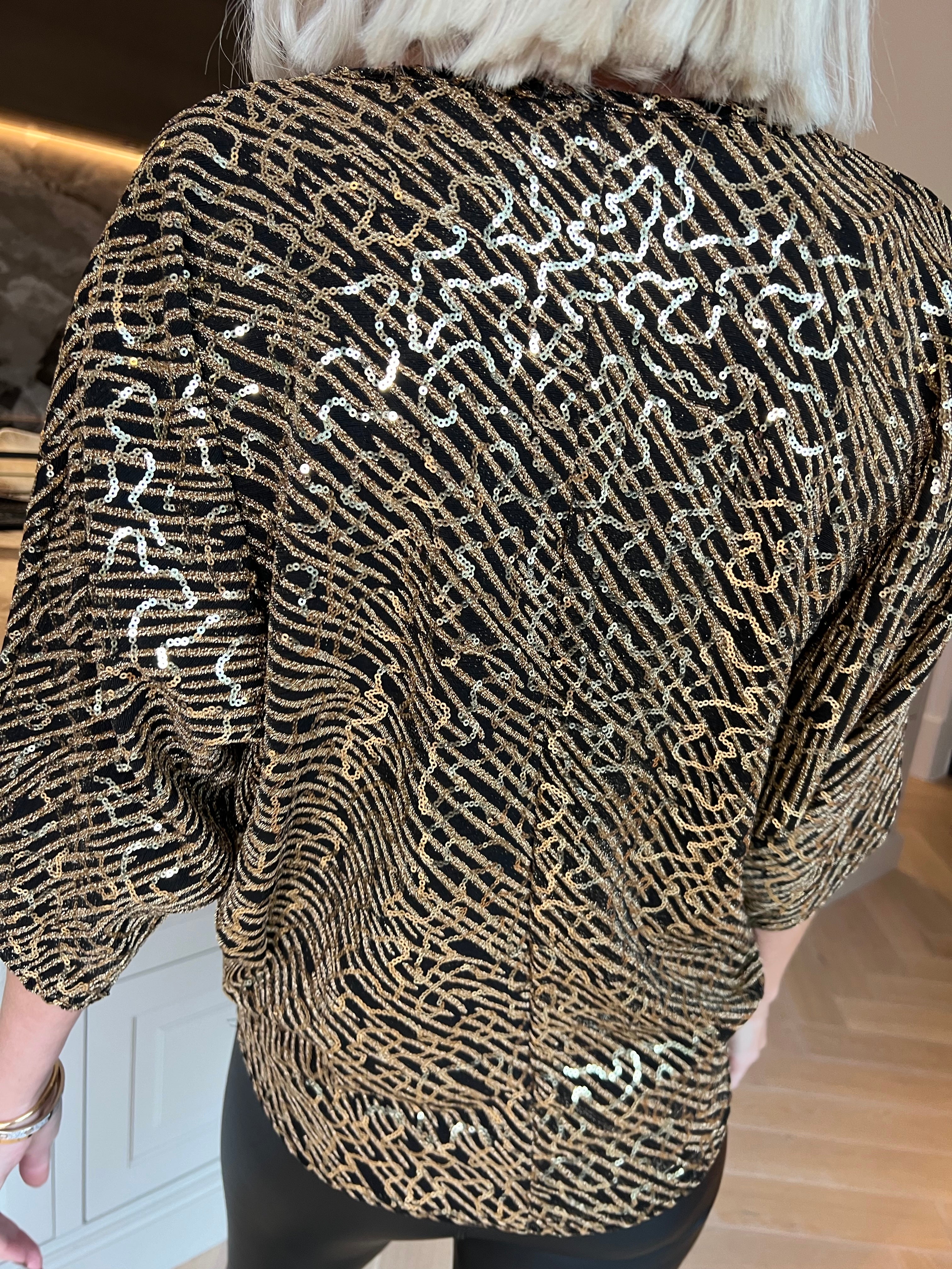 Kate - Festlig tunika med glittrande trådar och fina paljetter som ger en glamorös look
