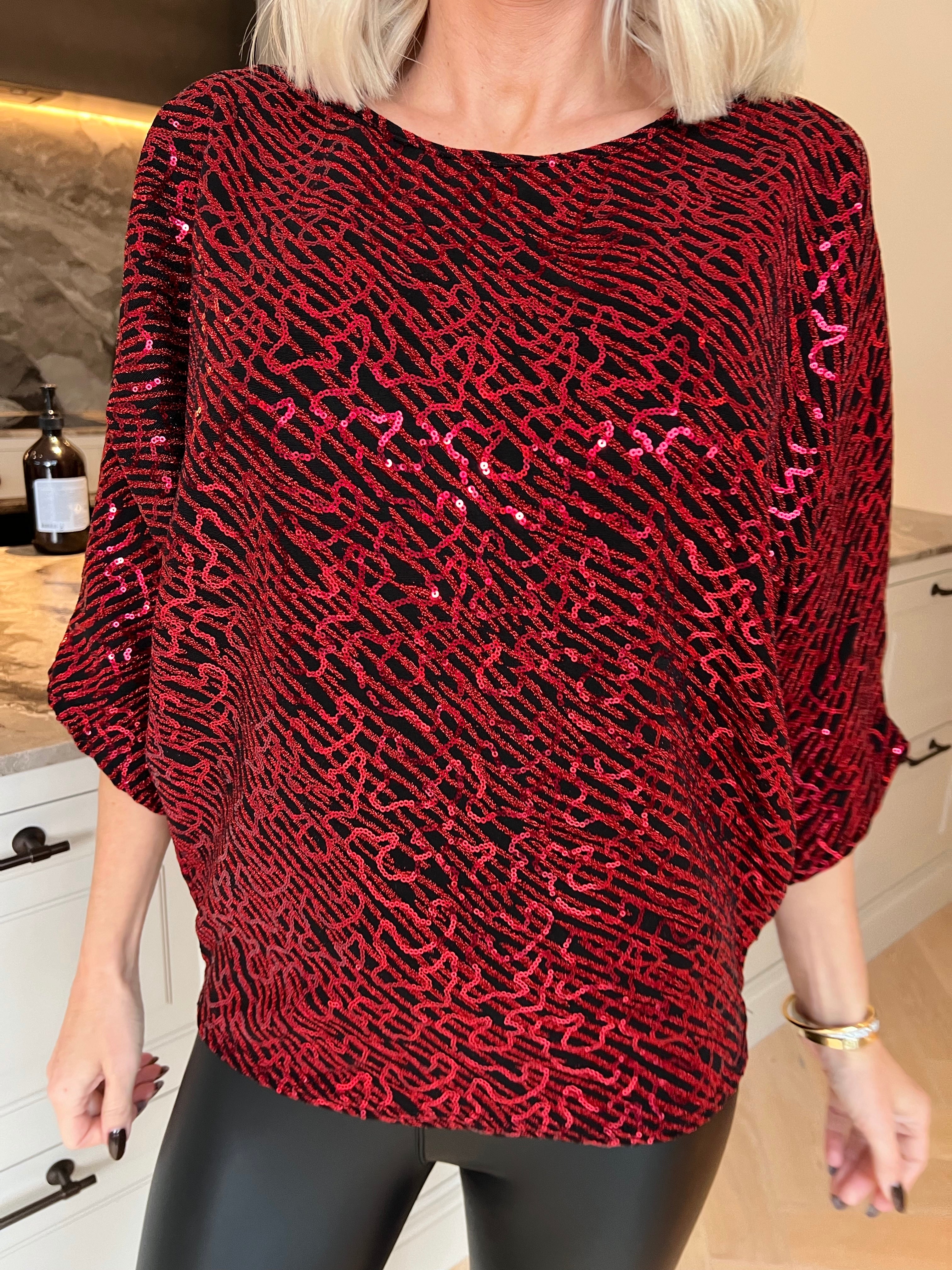 Kate - Festlig tunika med glittrande trådar och fina paljetter som ger en glamorös look