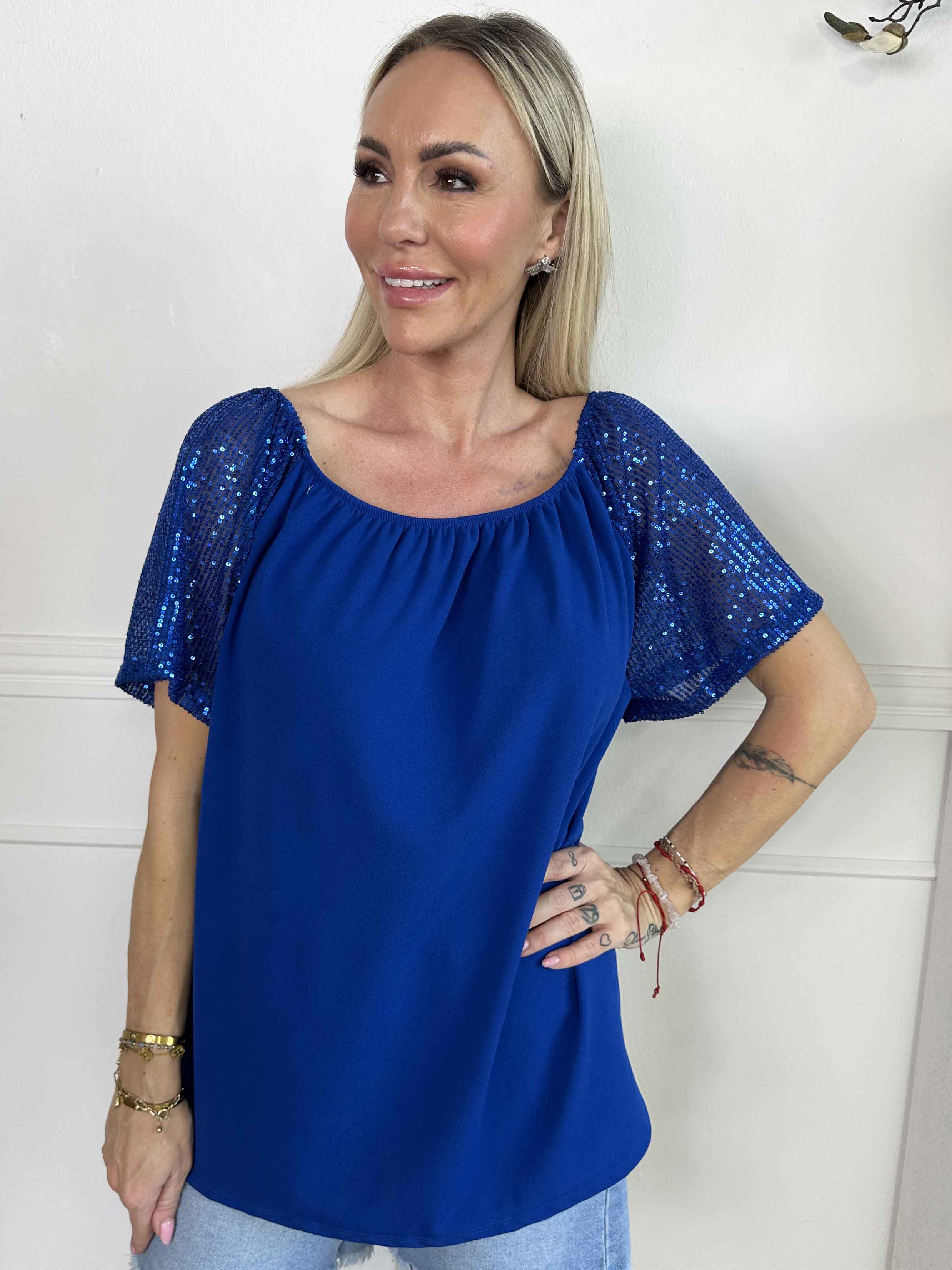 Kim Shirt - Söt och feminin blus med resår och ärmar med glittriga paljetter