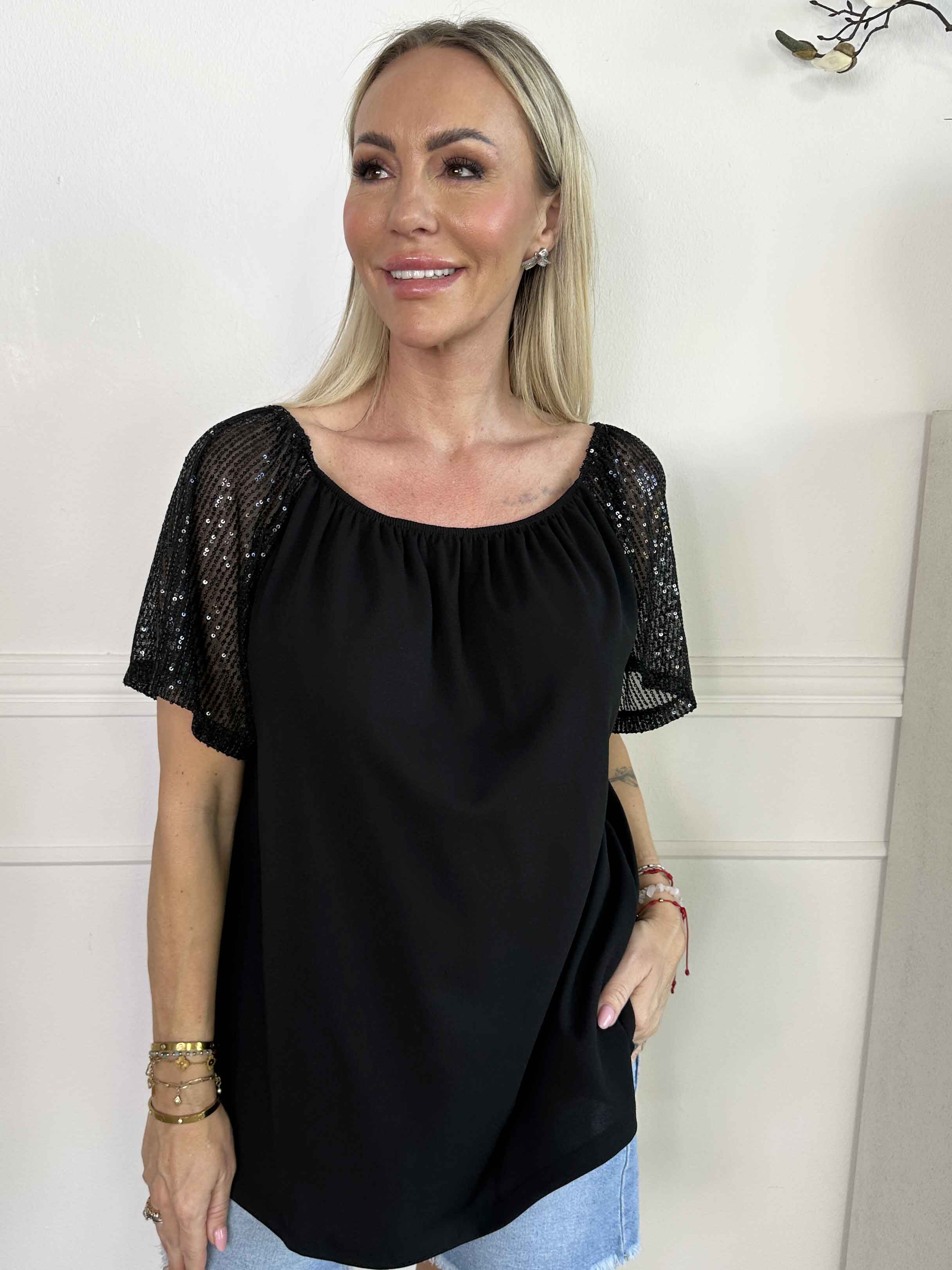 Kim Shirt - Söt och feminin blus med resår och ärmar med glittriga paljetter