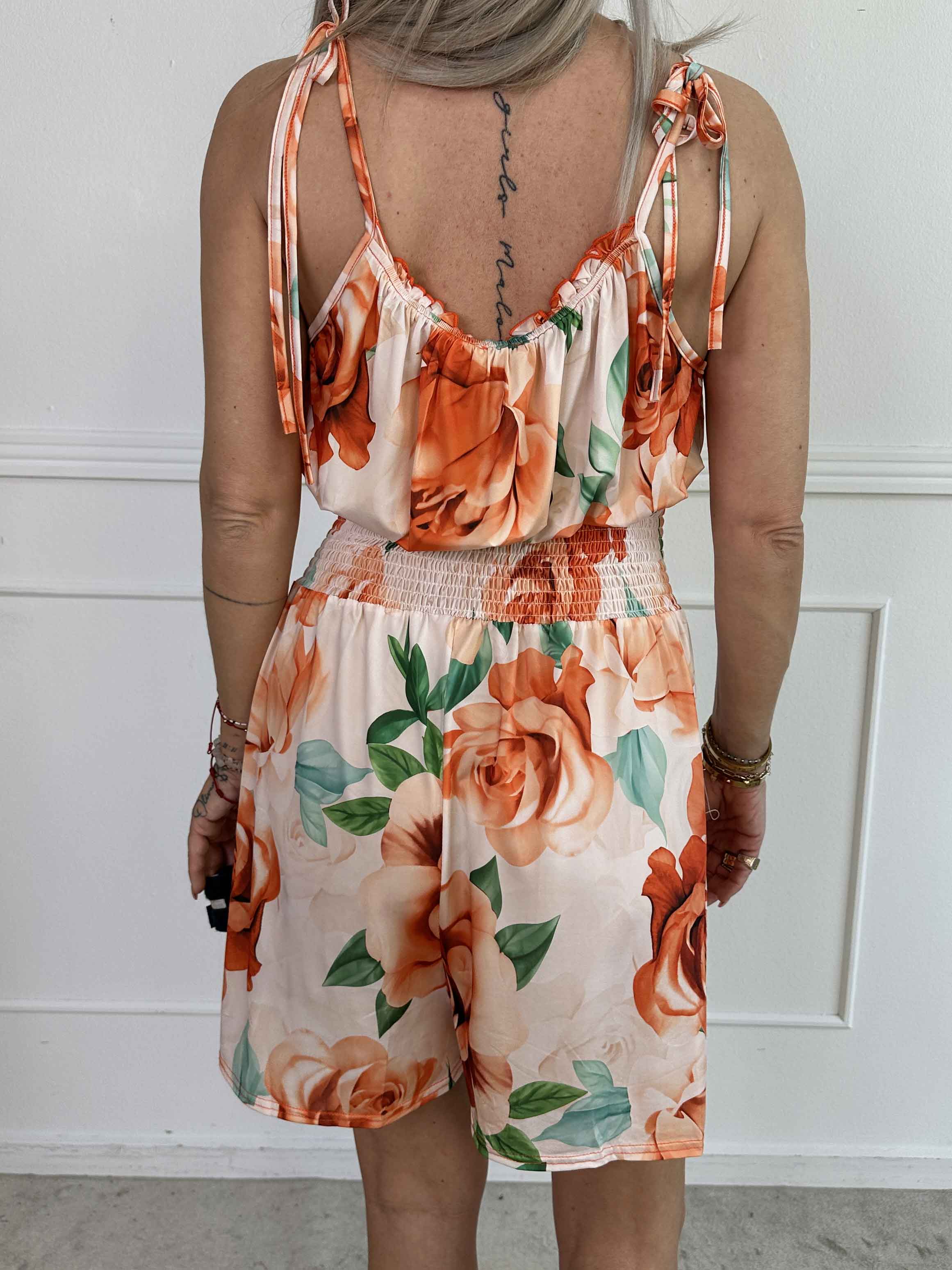 Lyra - Elastisk plus size buksedragt med smock i taljen