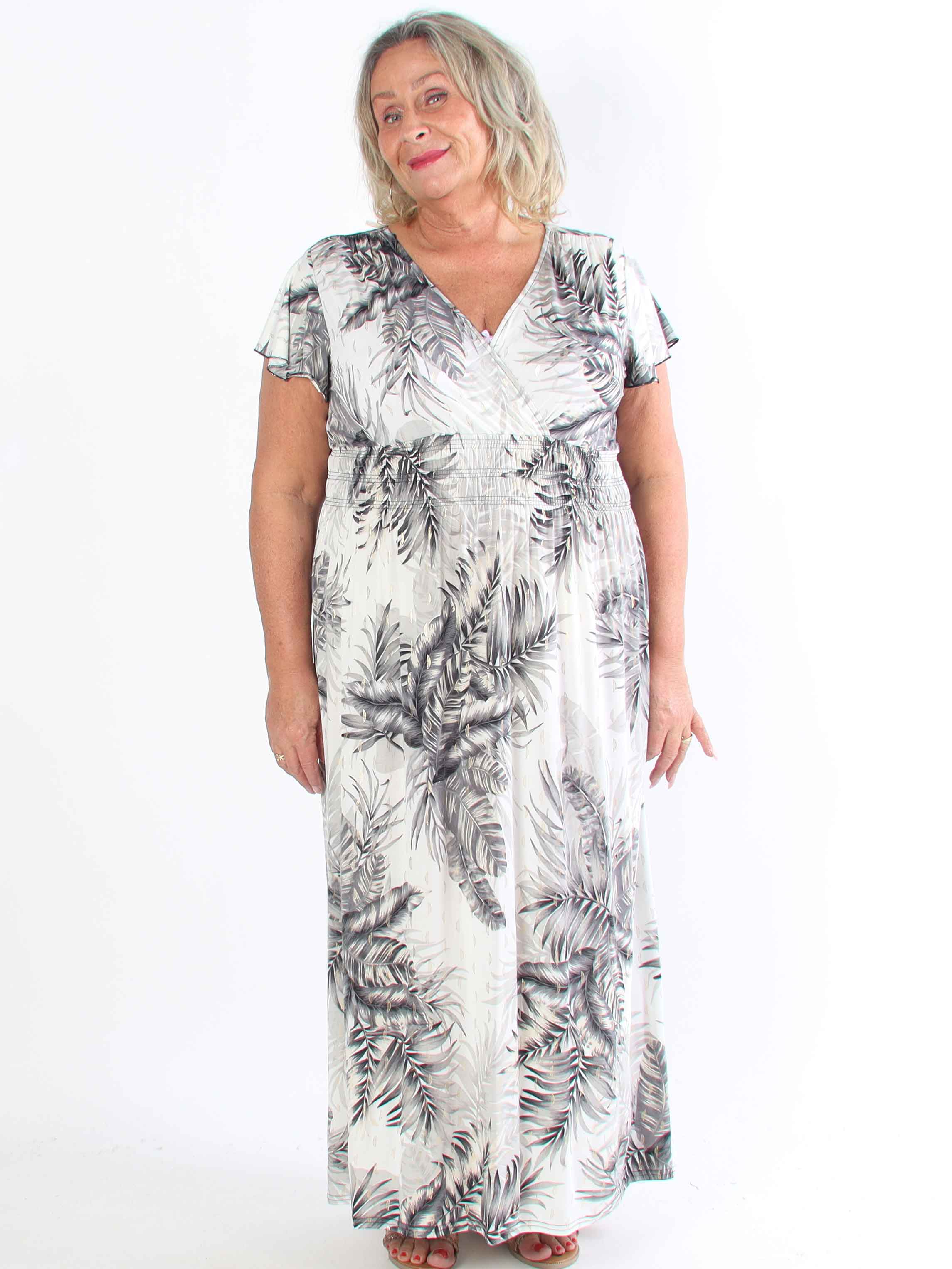 Palma - Elastisk klänning i plus size med blad och volangärmar