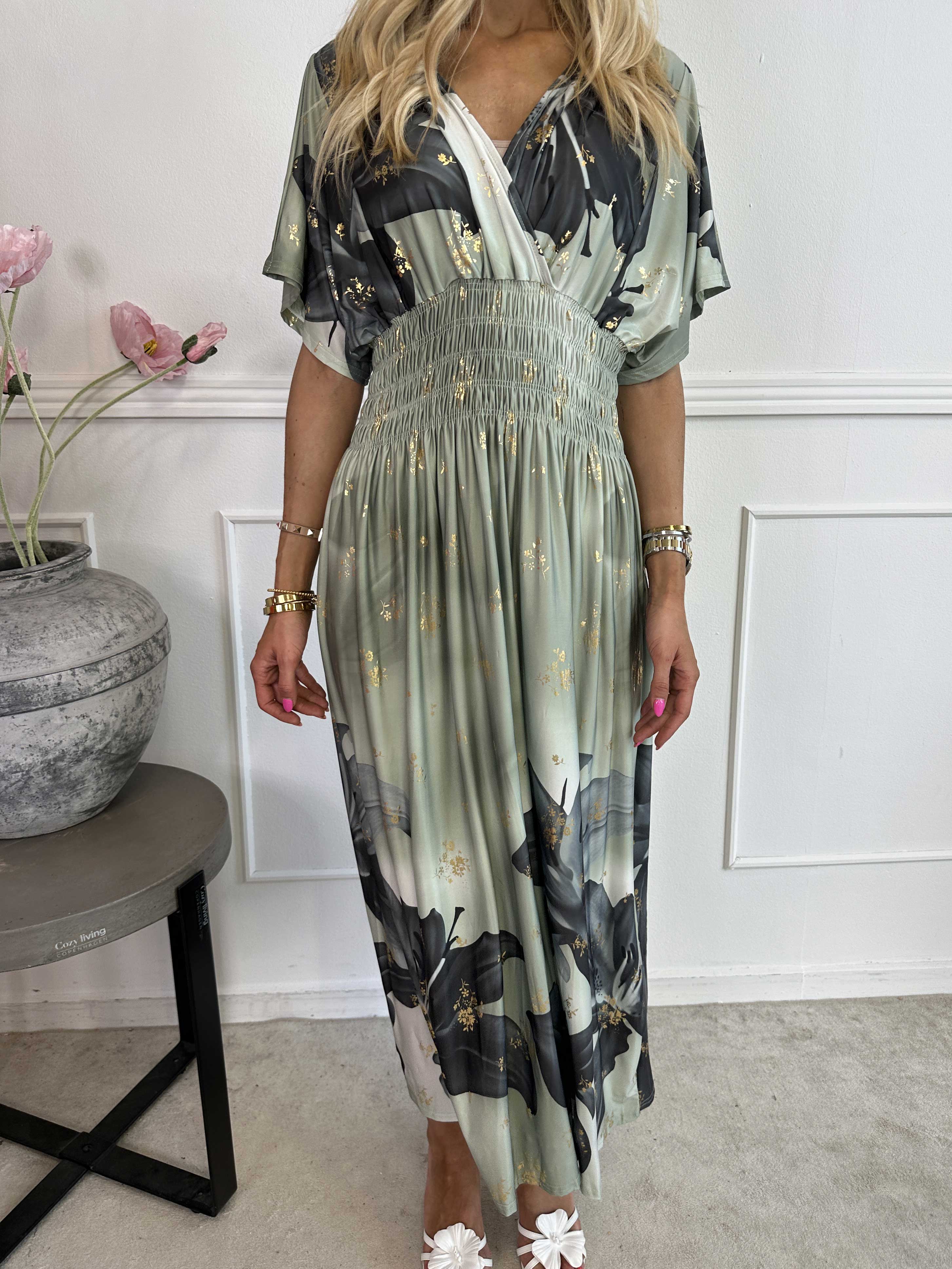 Pams Big Lily - Elastisk klänning med stora liljor och gulddetaljer